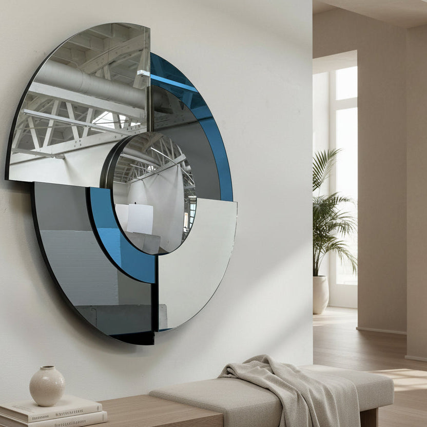 The Roche Bobois Merlin Mirror - Smoked gray / Blue features round geometric segments, making it a striking statement wall mirror from Roche Bobois.