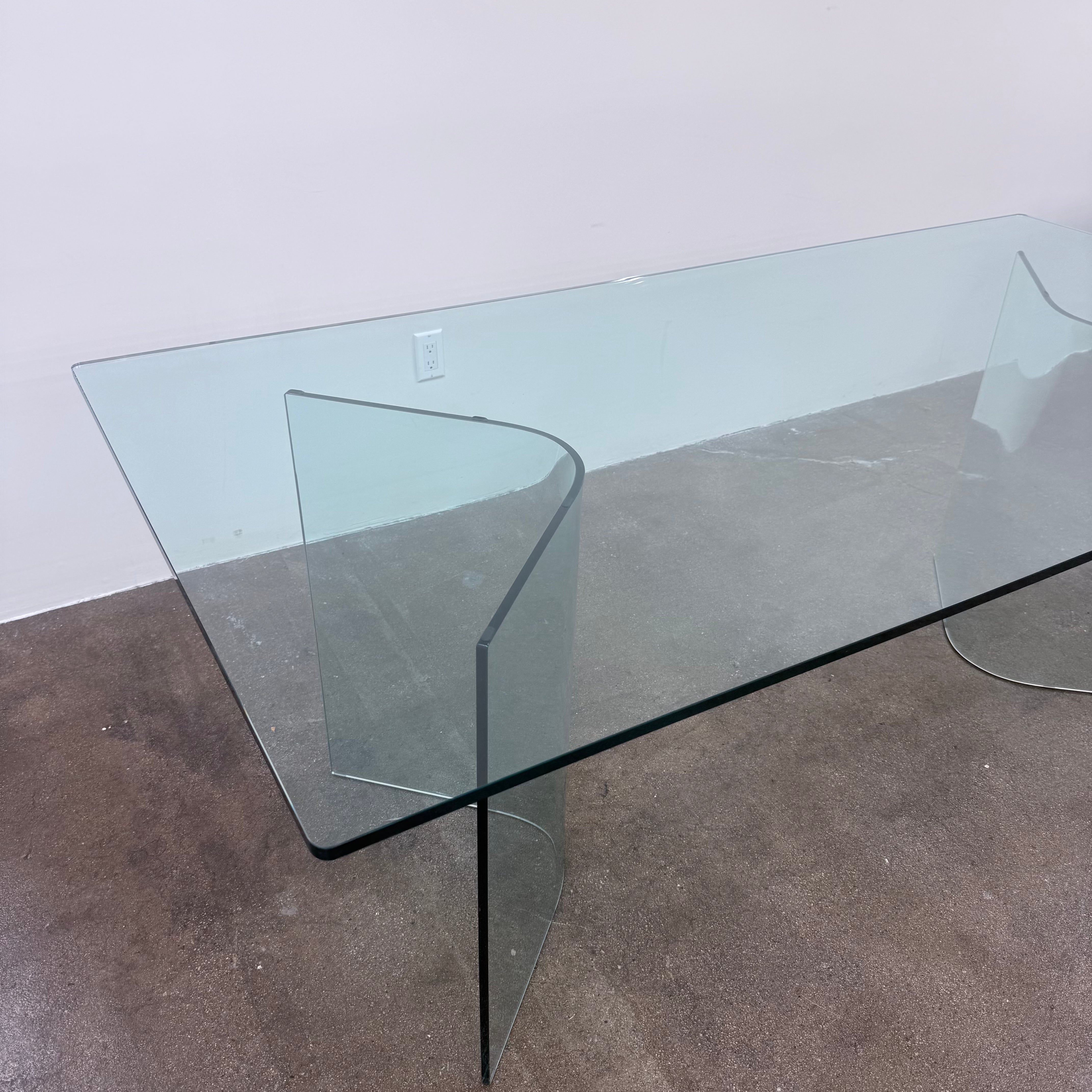Fiam Italia Corner Dining Table, a rectangular glass table with two curved glass pedestal bases.
