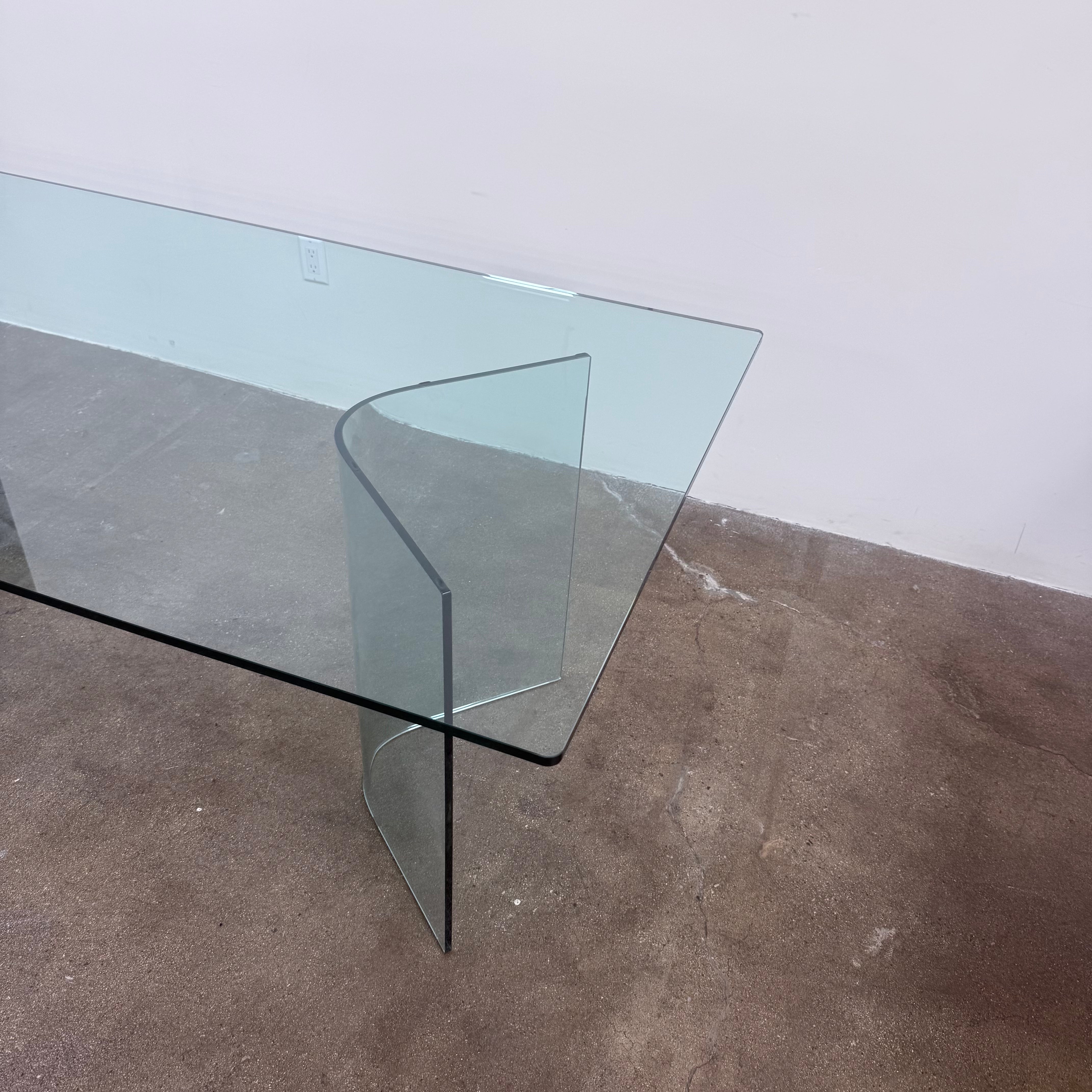 Fiam Italia Corner Dining Table, a rectangular glass table with two curved glass pedestal bases.