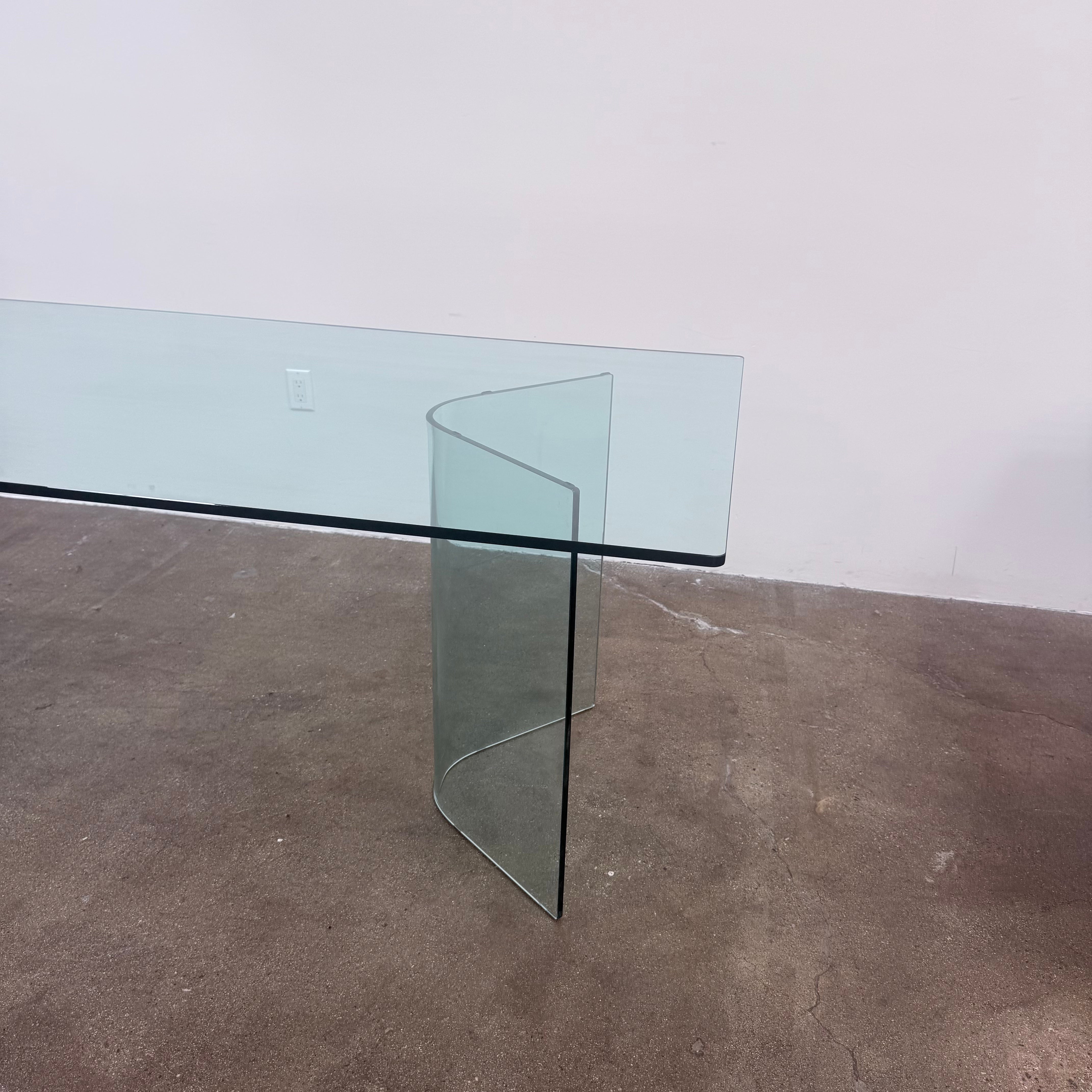 Fiam Italia Corner Dining Table, a rectangular glass table with two curved glass pedestal bases.