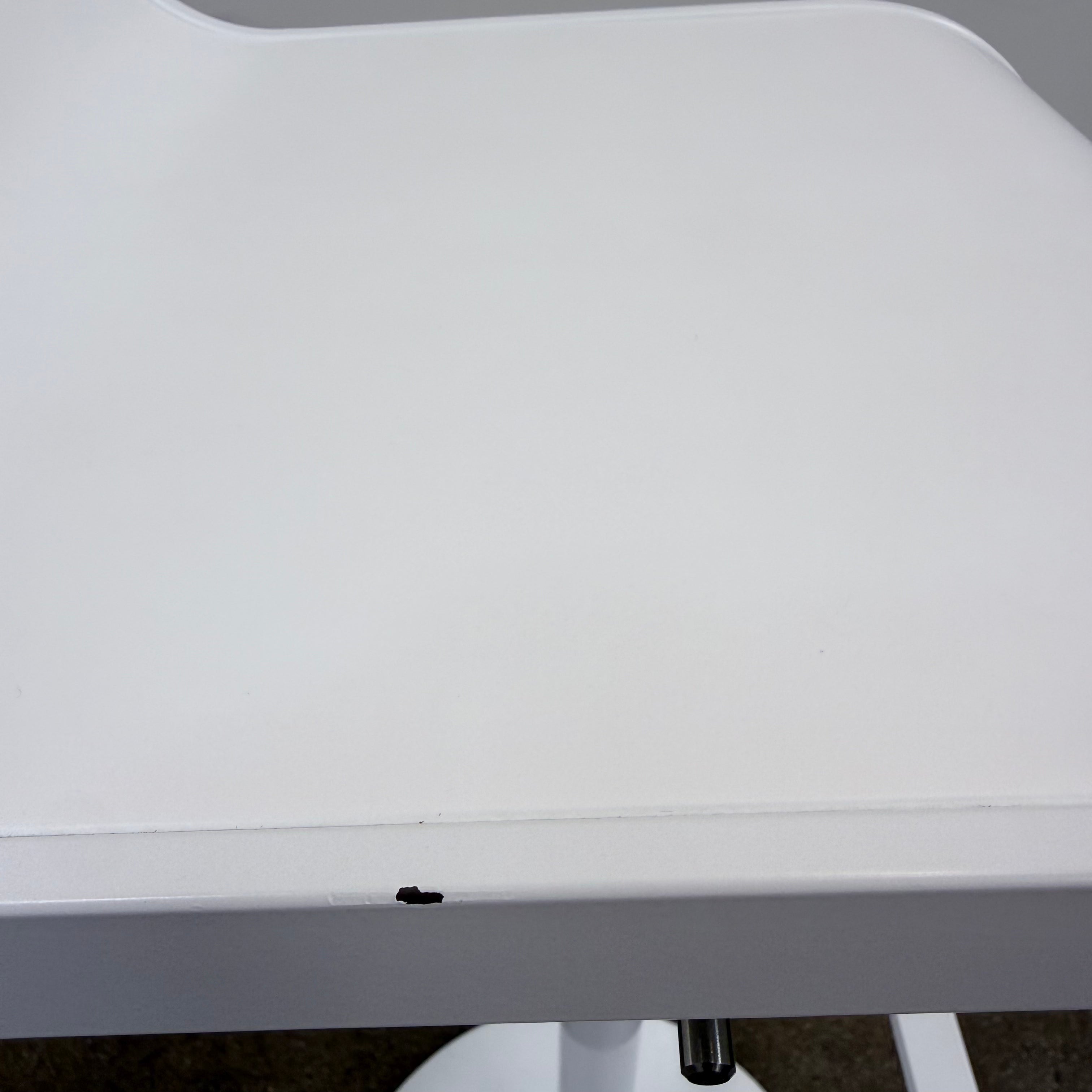 Two white LEM Piston Stools by La Palma featuring pedestal bases and rectangular footrests.