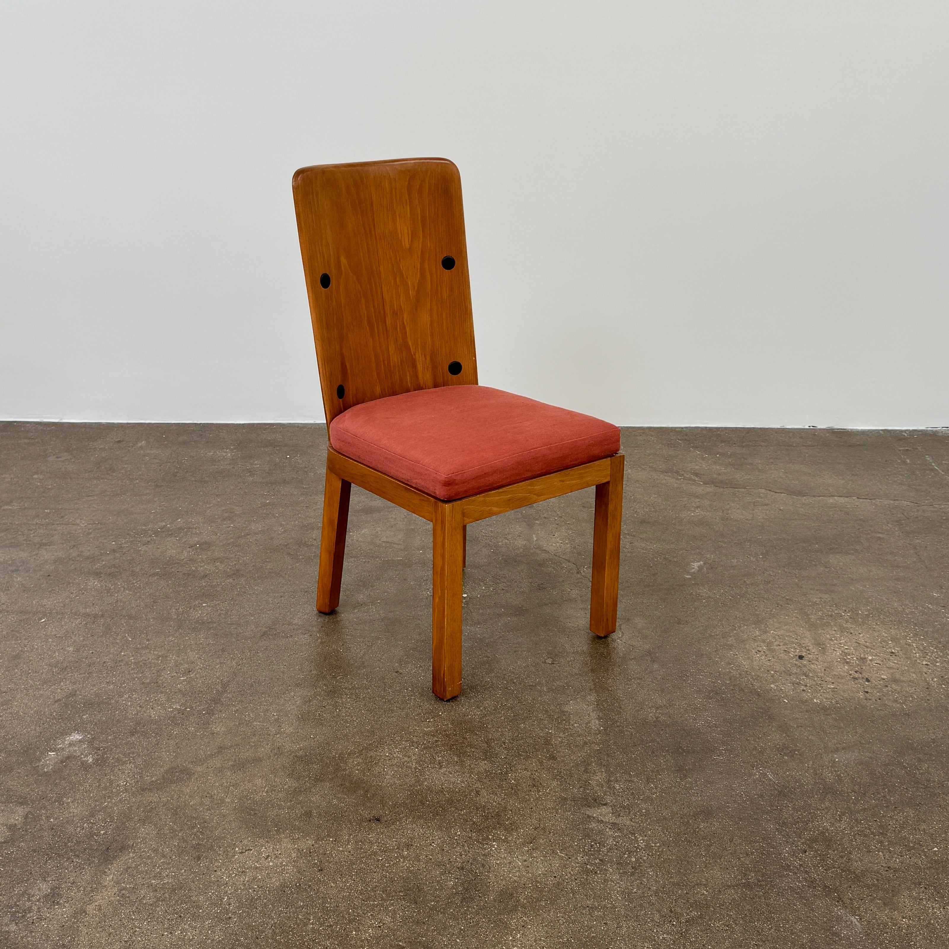 A set of six Waldo's Designs dining chairs in the style of Axel Enar Lovo, featuring rectangular backs and coral upholstery, are neatly arranged in two rows against a plain white background.