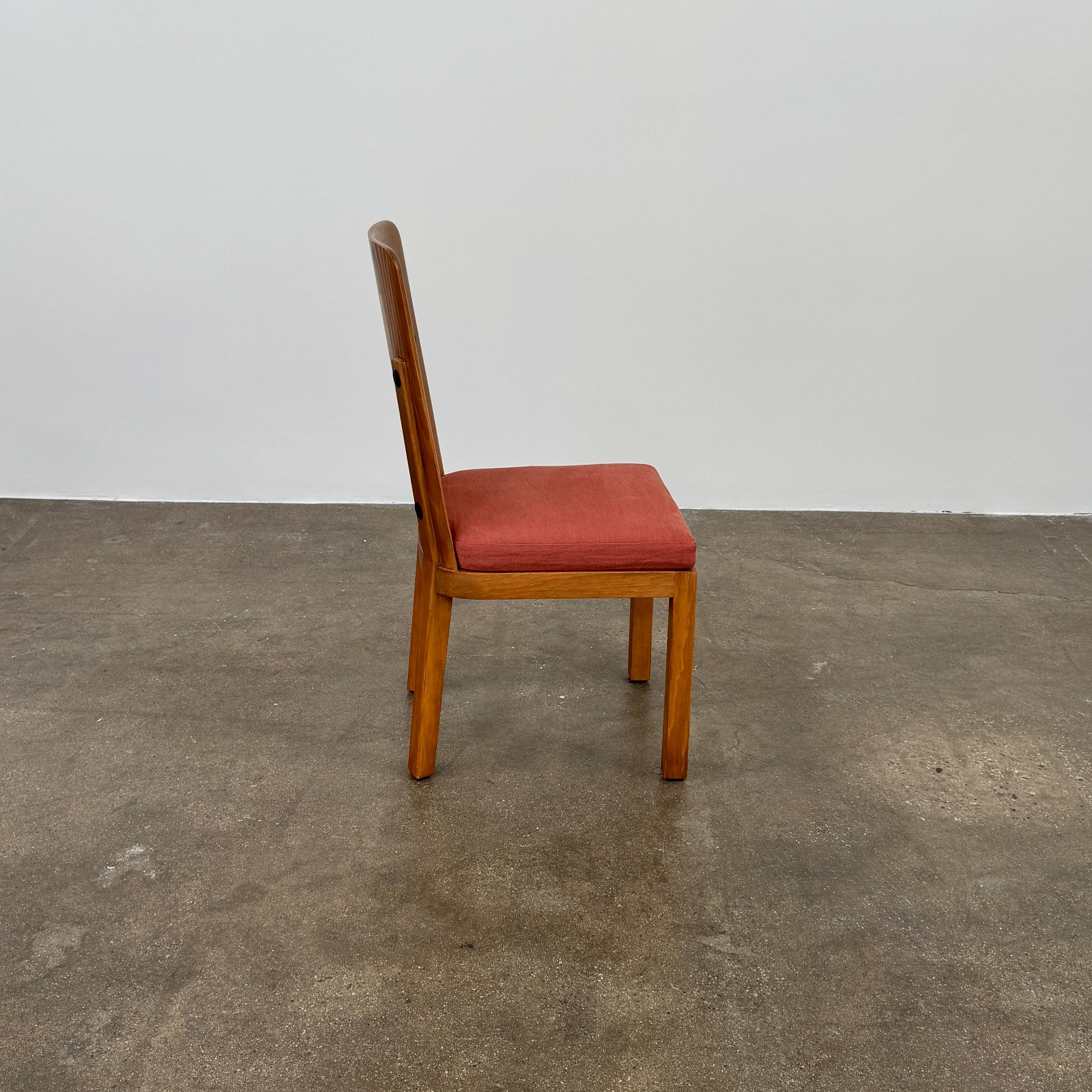 A set of six Waldo's Designs dining chairs in the style of Axel Enar Lovo, featuring rectangular backs and coral upholstery, are neatly arranged in two rows against a plain white background.