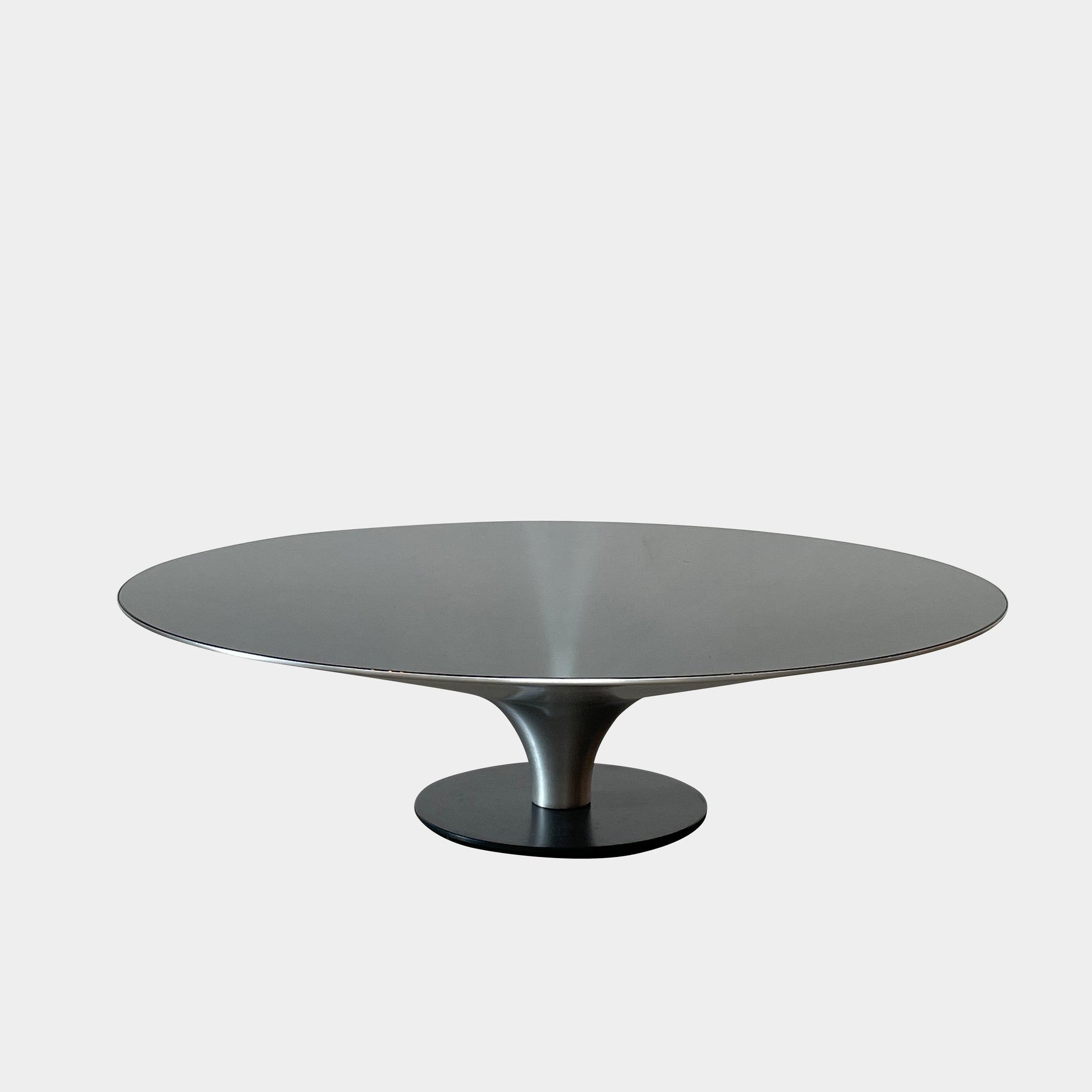 Three Roche Bobois Ovni Cocktail Tables of different sizes with reflective surfaces, isolated on a white background.