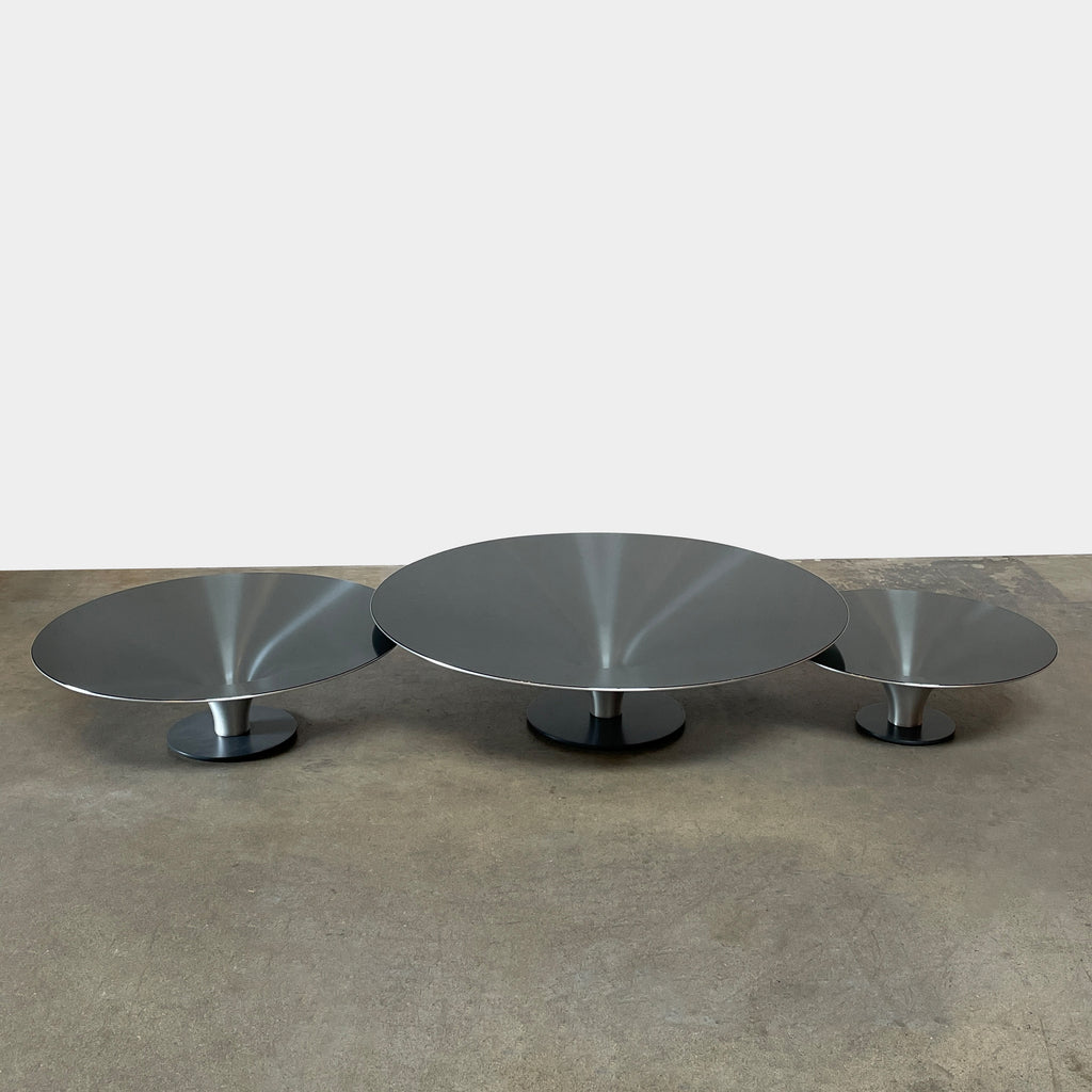 Three Roche Bobois Ovni Cocktail Tables of different sizes with reflective surfaces, isolated on a white background.