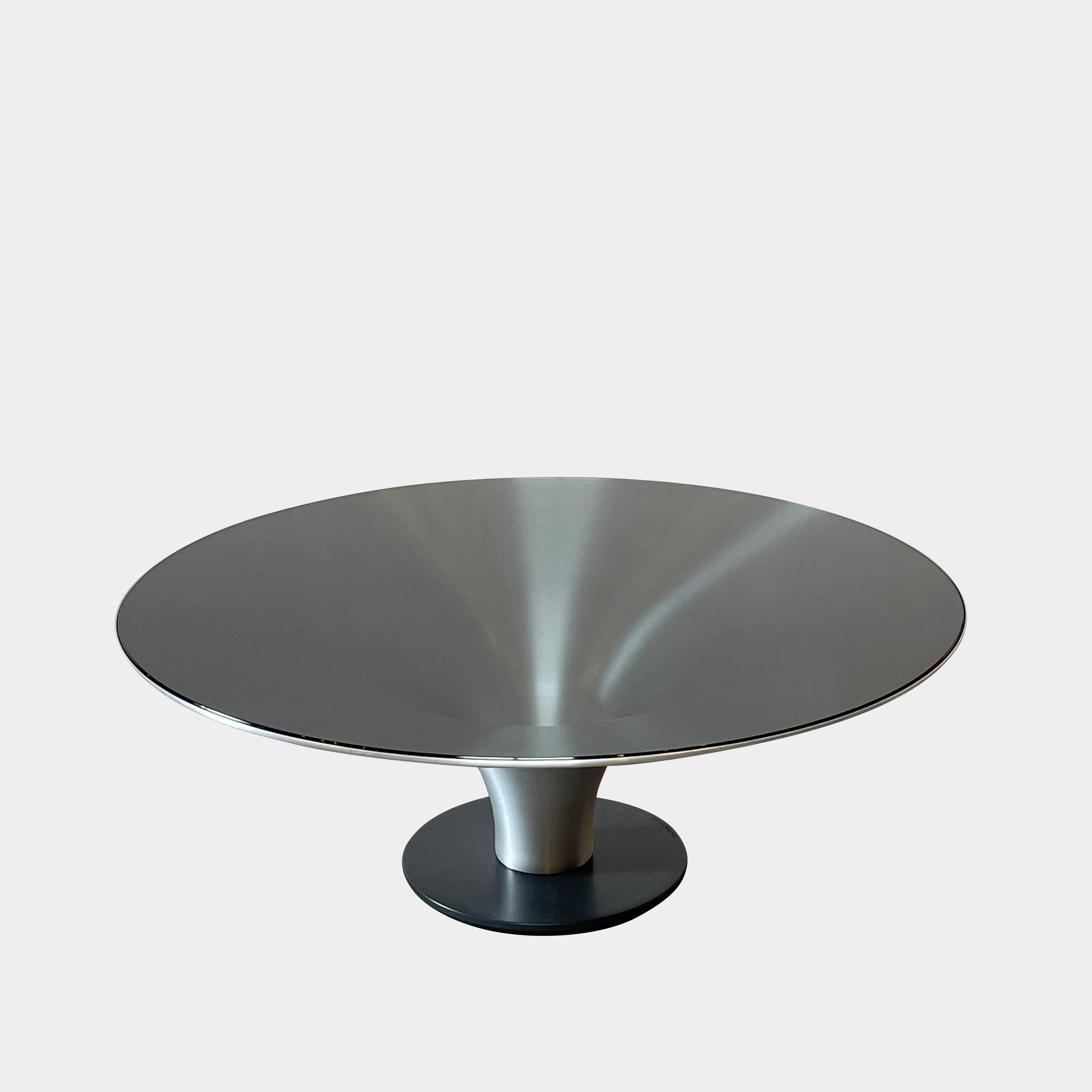 Three Roche Bobois Ovni Cocktail Tables of different sizes with reflective surfaces, isolated on a white background.