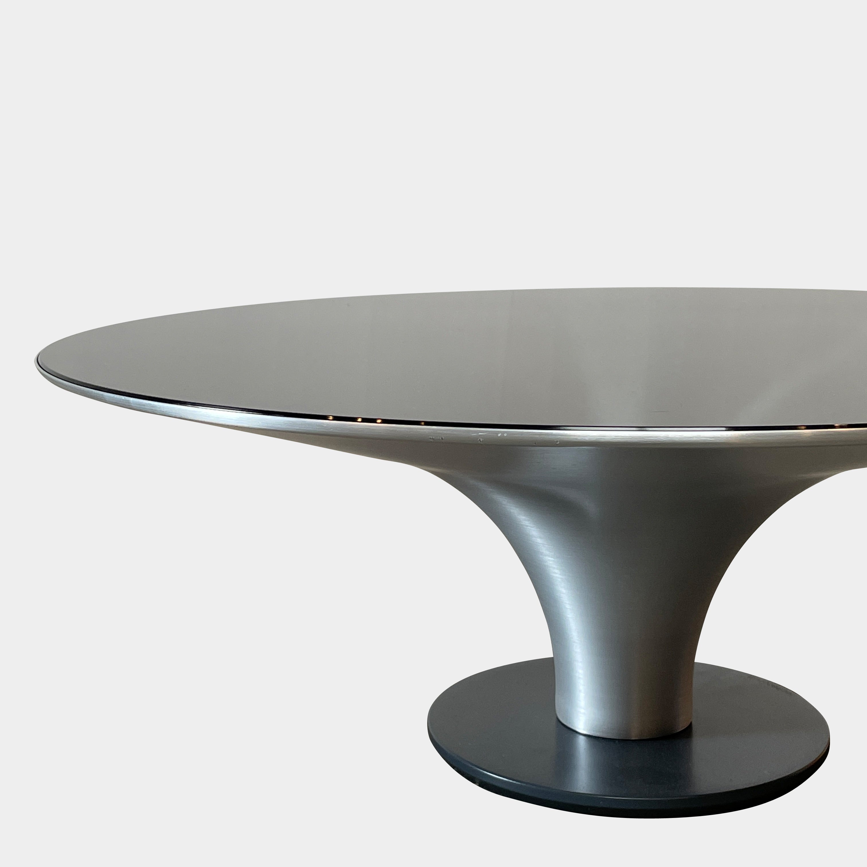 Three Roche Bobois Ovni Cocktail Tables of different sizes with reflective surfaces, isolated on a white background.