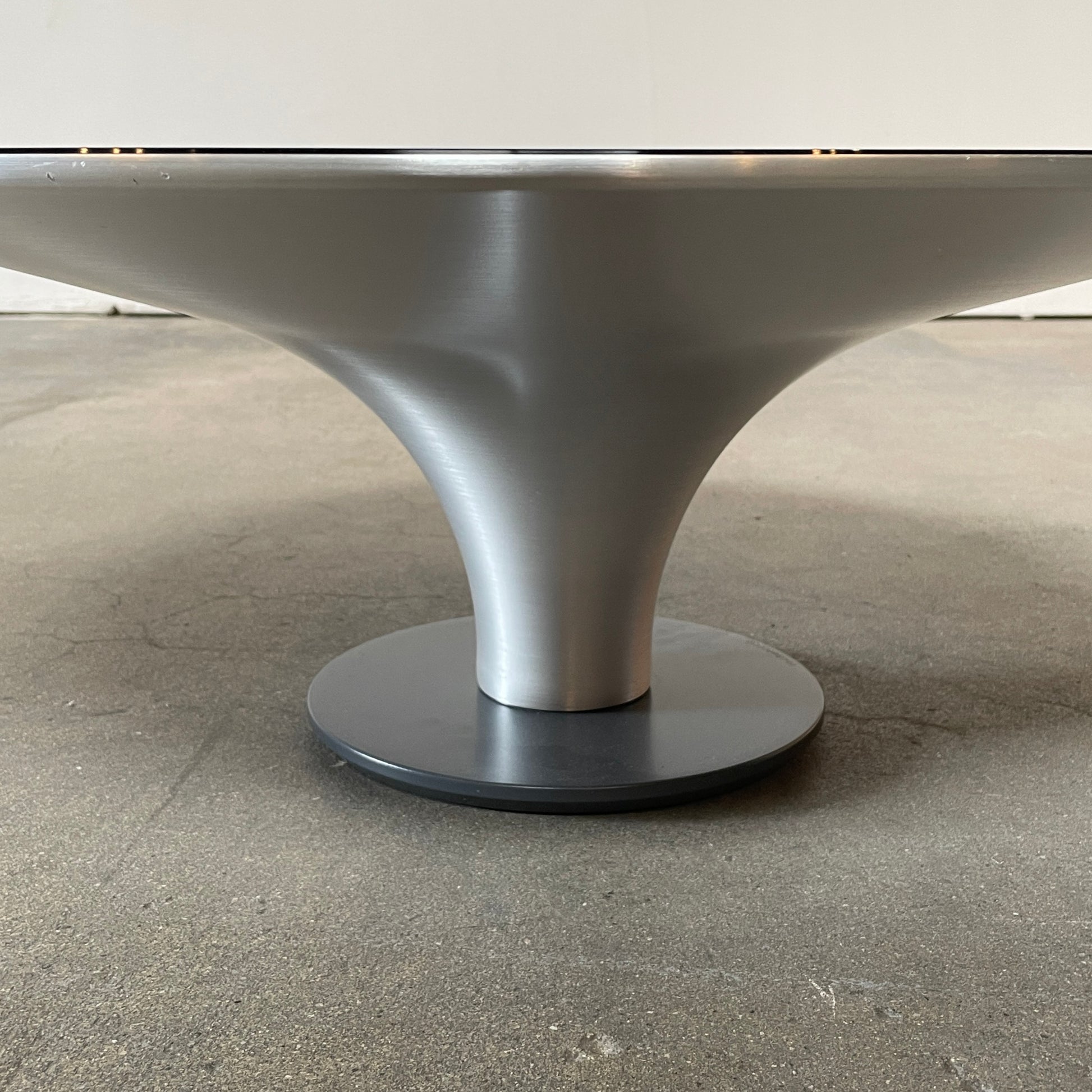 Three Roche Bobois Ovni Cocktail Tables of different sizes with reflective surfaces, isolated on a white background.