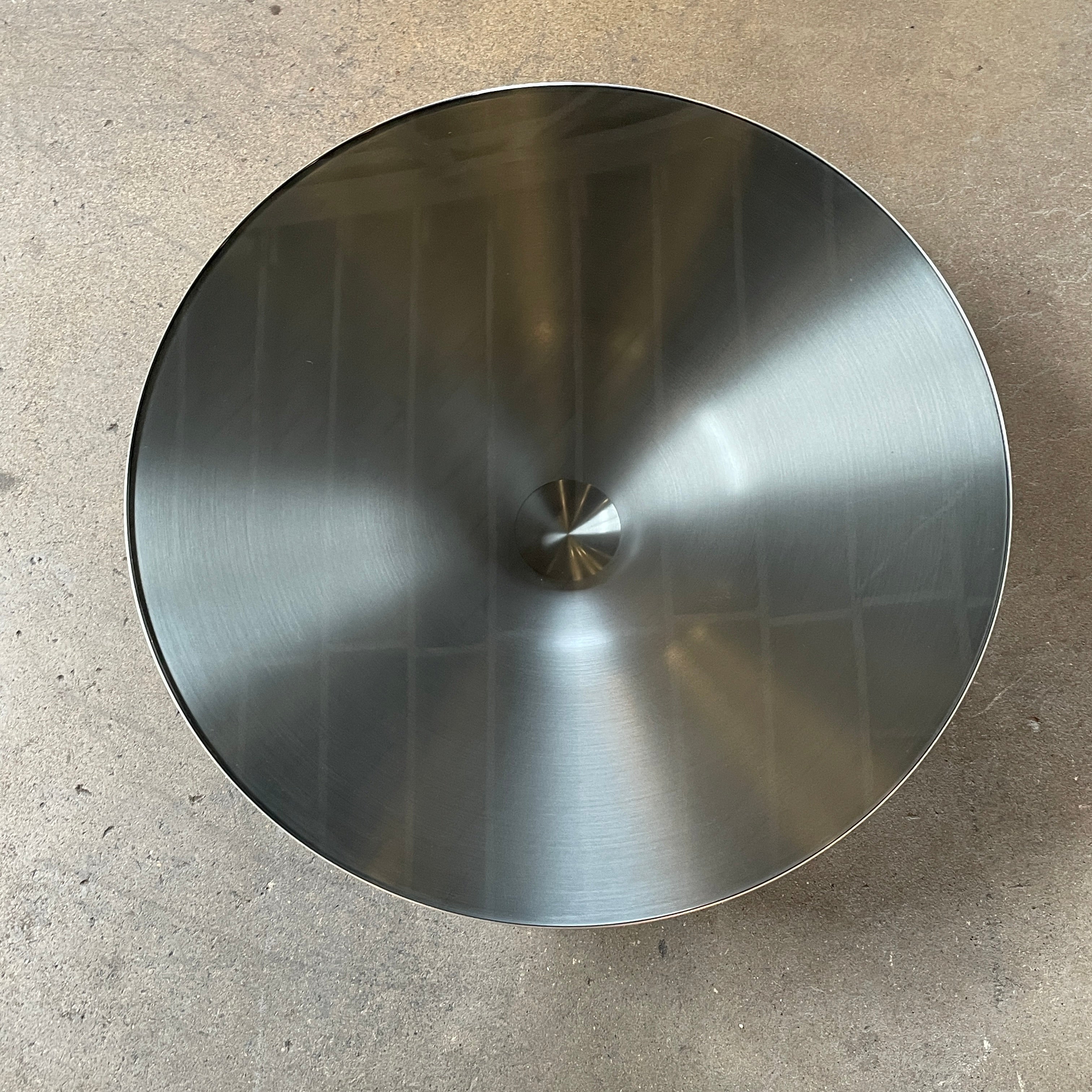 Three Roche Bobois Ovni Cocktail Tables of different sizes with reflective surfaces, isolated on a white background.