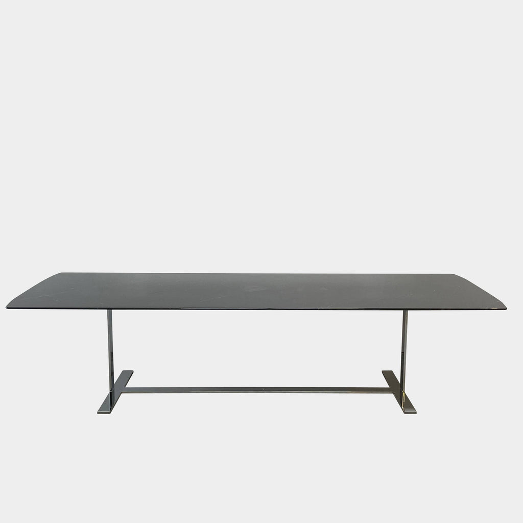 A B&B Italia Eileen dining table with a metal base.