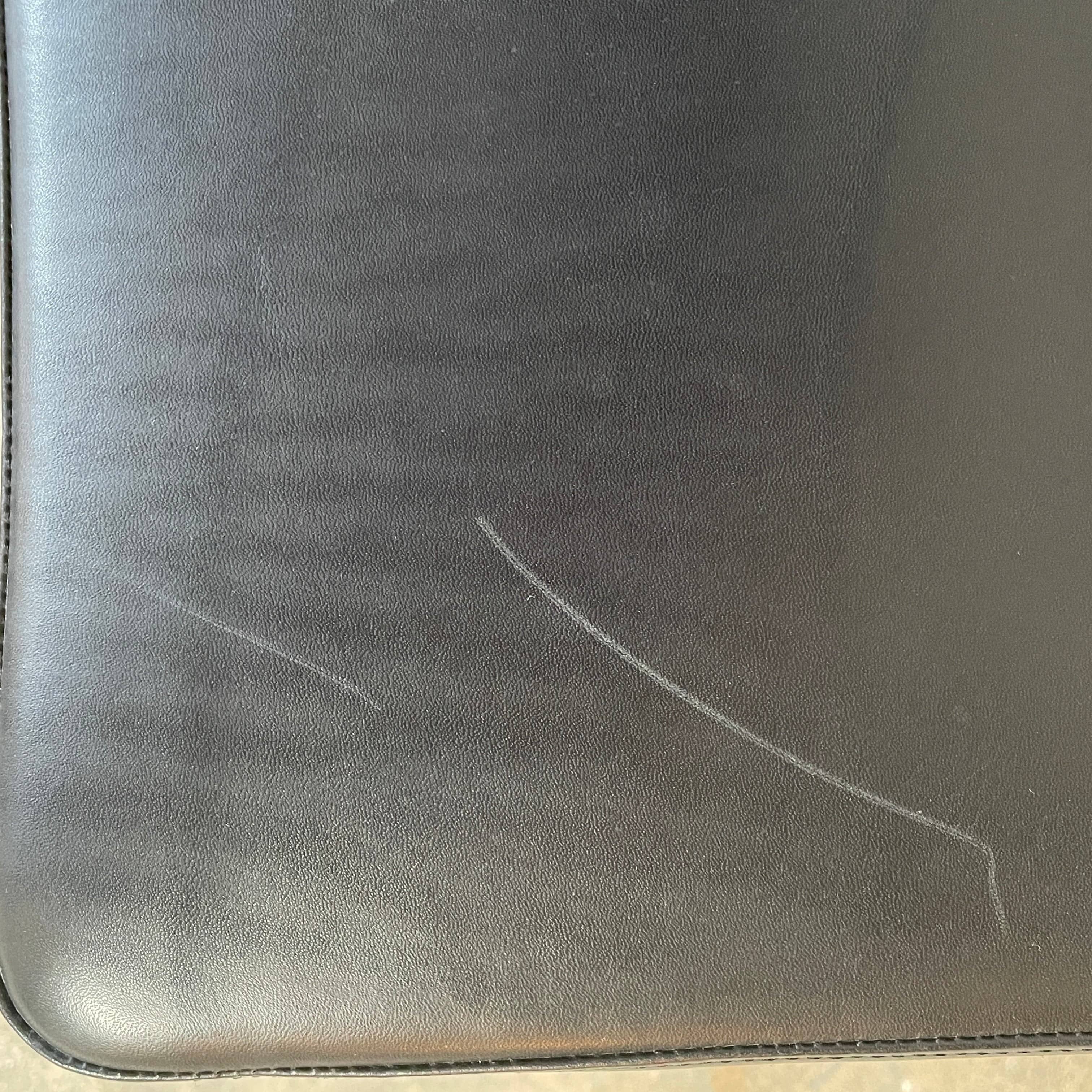 Five black B&B Italia Metropolitan dining chairs designed by Jeffrey Bernett, arranged in a row on a white background.