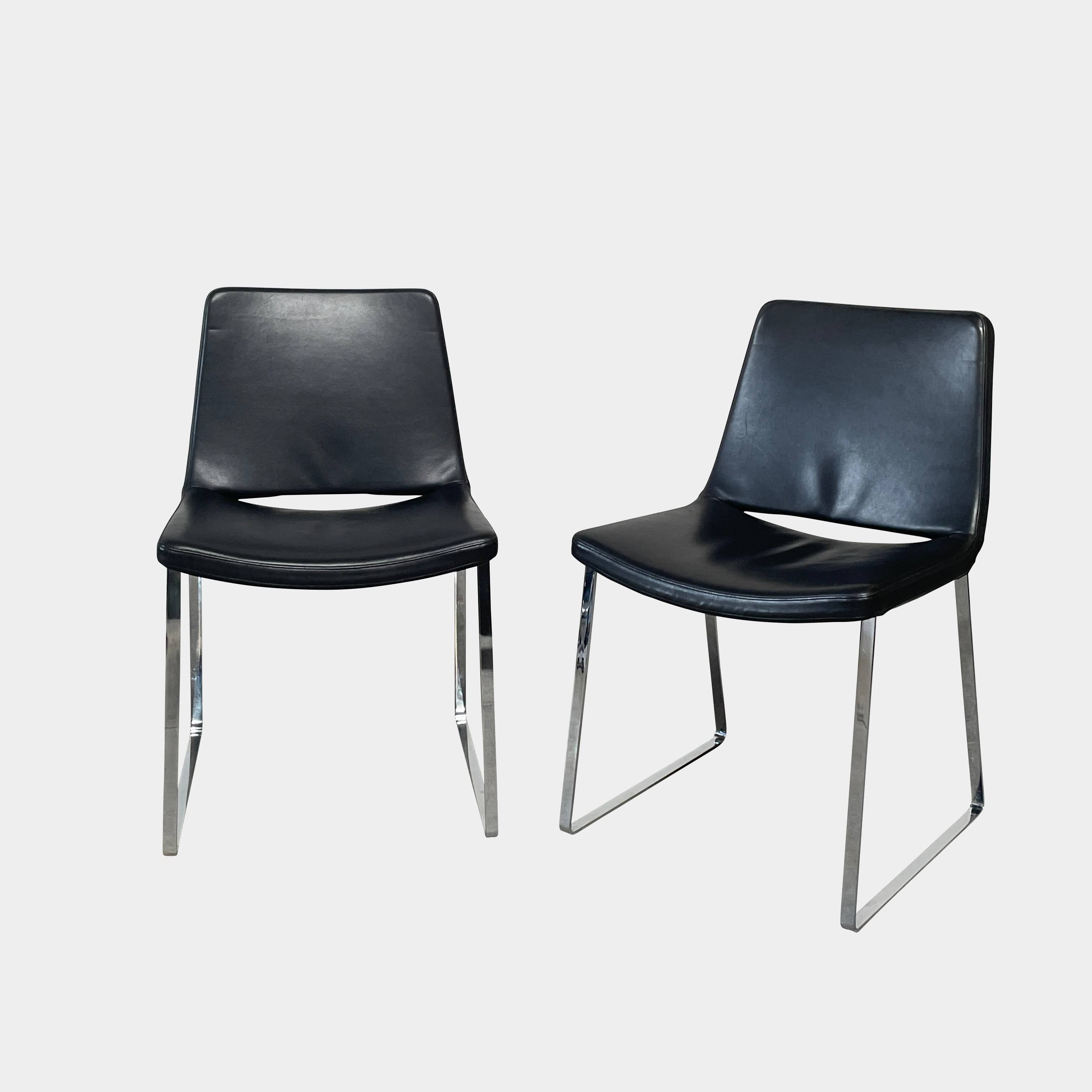 Five black B&B Italia Metropolitan dining chairs designed by Jeffrey Bernett, arranged in a row on a white background.