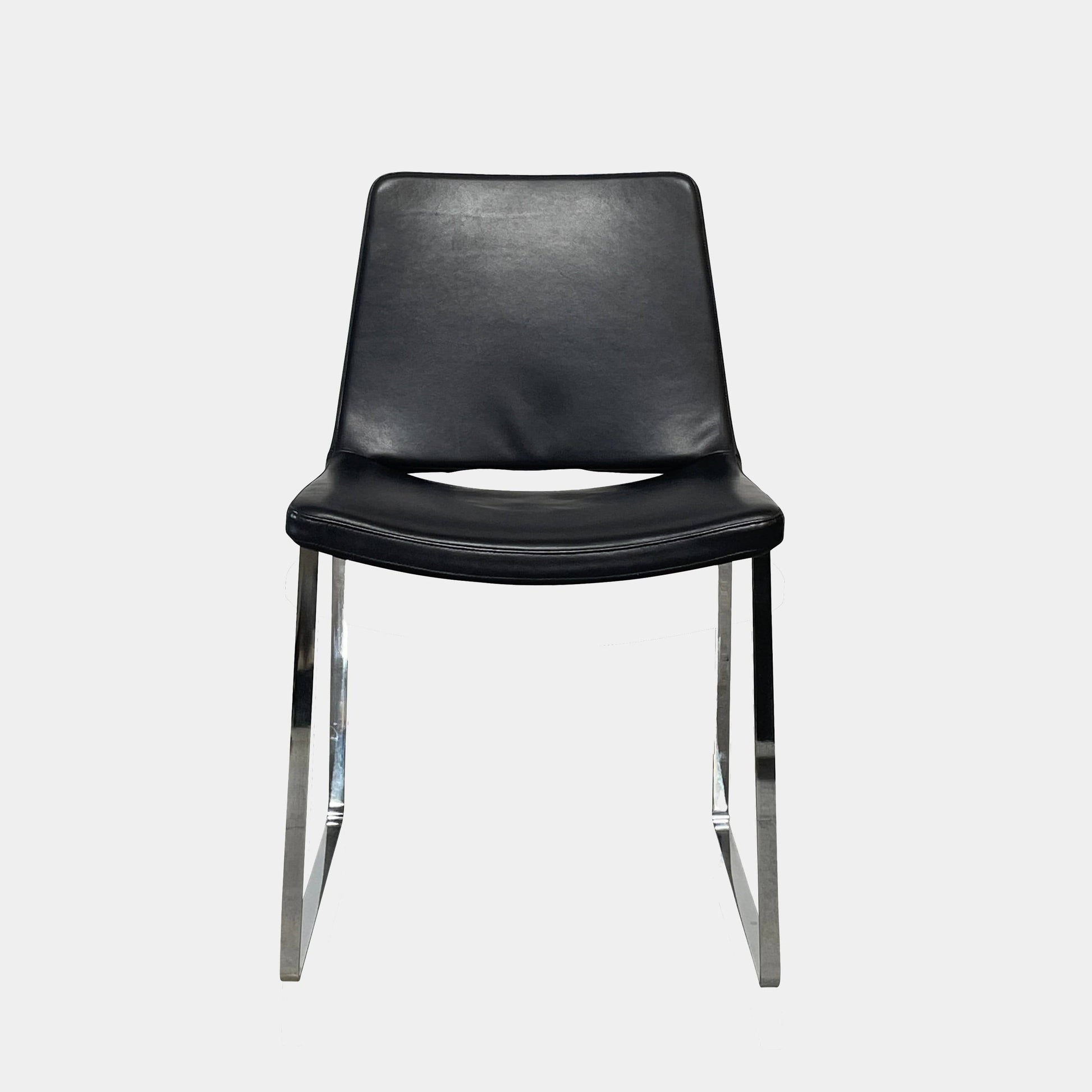 Five black B&B Italia Metropolitan dining chairs designed by Jeffrey Bernett, arranged in a row on a white background.