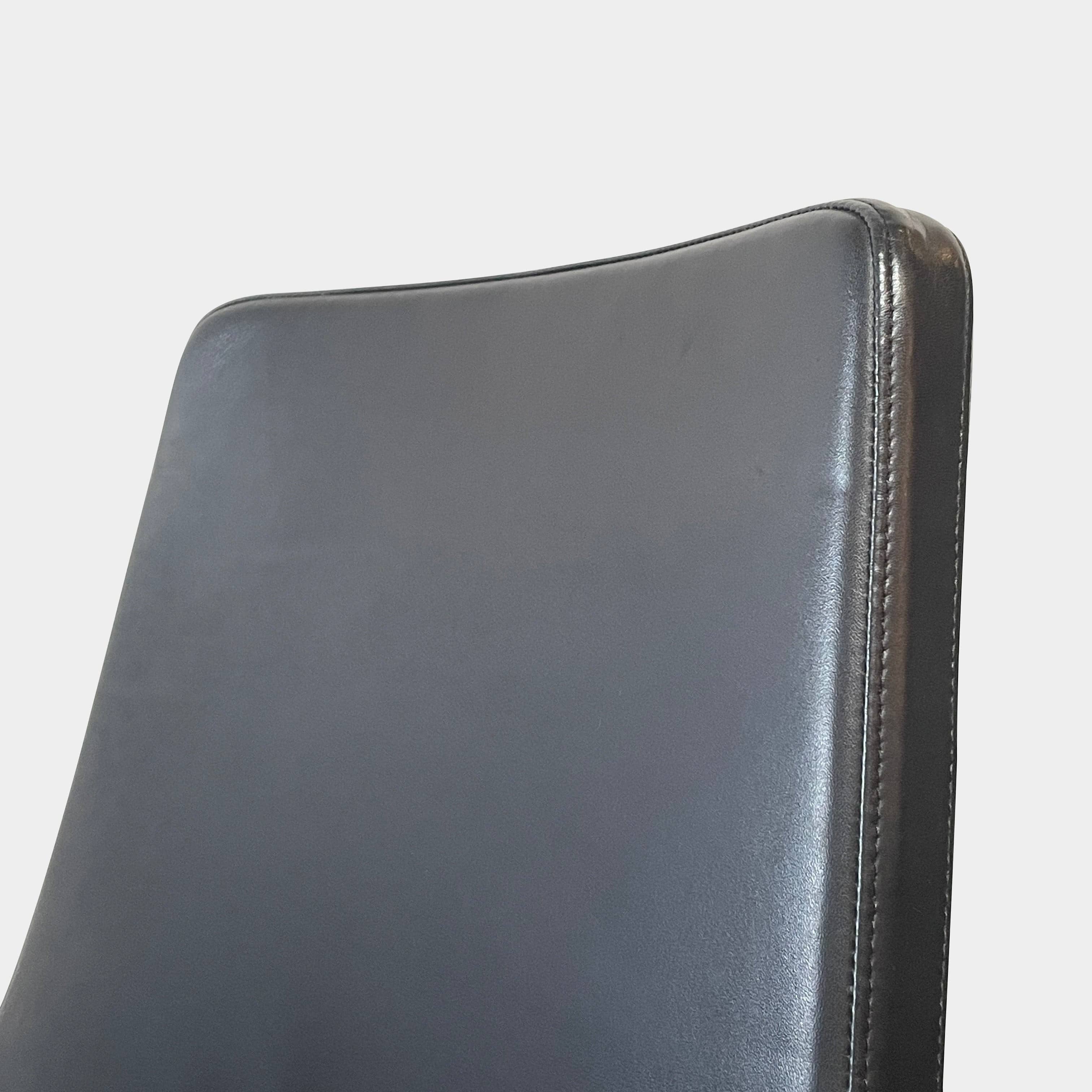 Five black B&B Italia Metropolitan dining chairs designed by Jeffrey Bernett, arranged in a row on a white background.