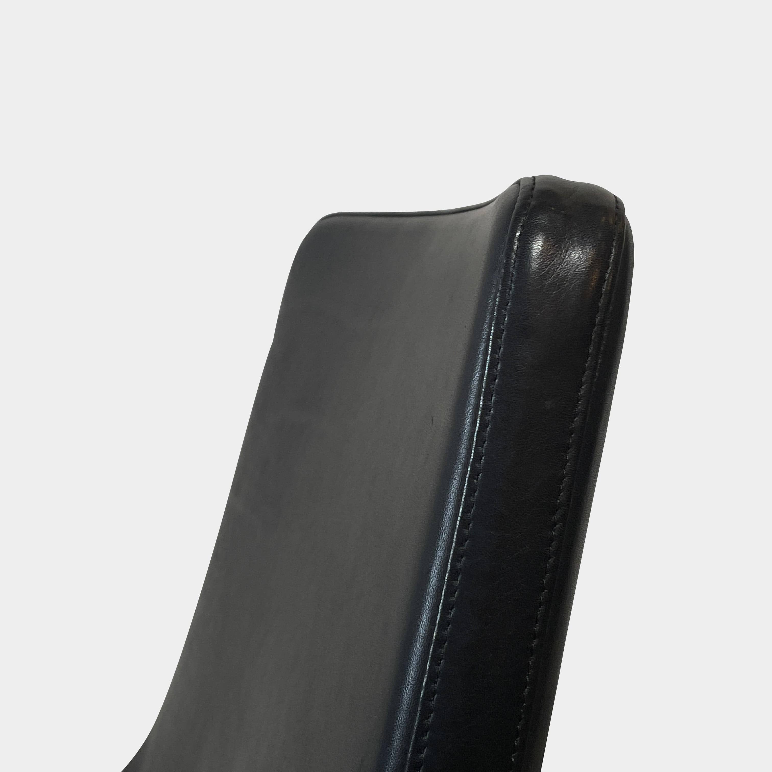 Five black B&B Italia Metropolitan dining chairs designed by Jeffrey Bernett, arranged in a row on a white background.