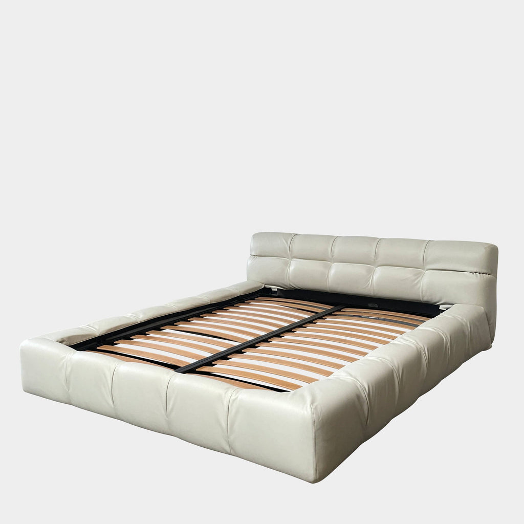 A B&B Italia Queen Sized Tufty Time Bed with wooden slats.
