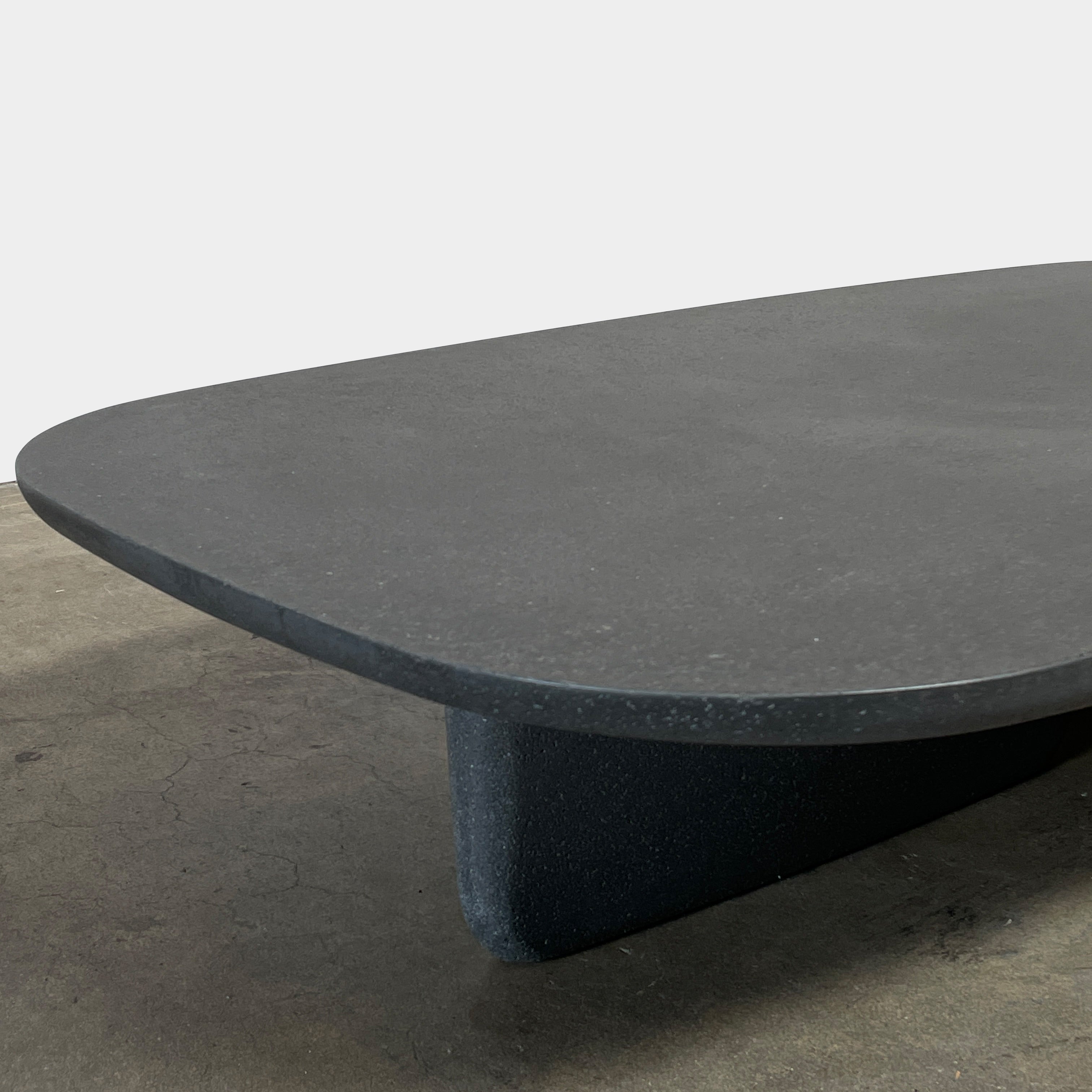 A rectangular black coffee table with asymmetrical supports on a white background, reminiscent of the B&B Italia Tobi-Ishi Outdoor Coffee Table (hold) by B&B Italia.