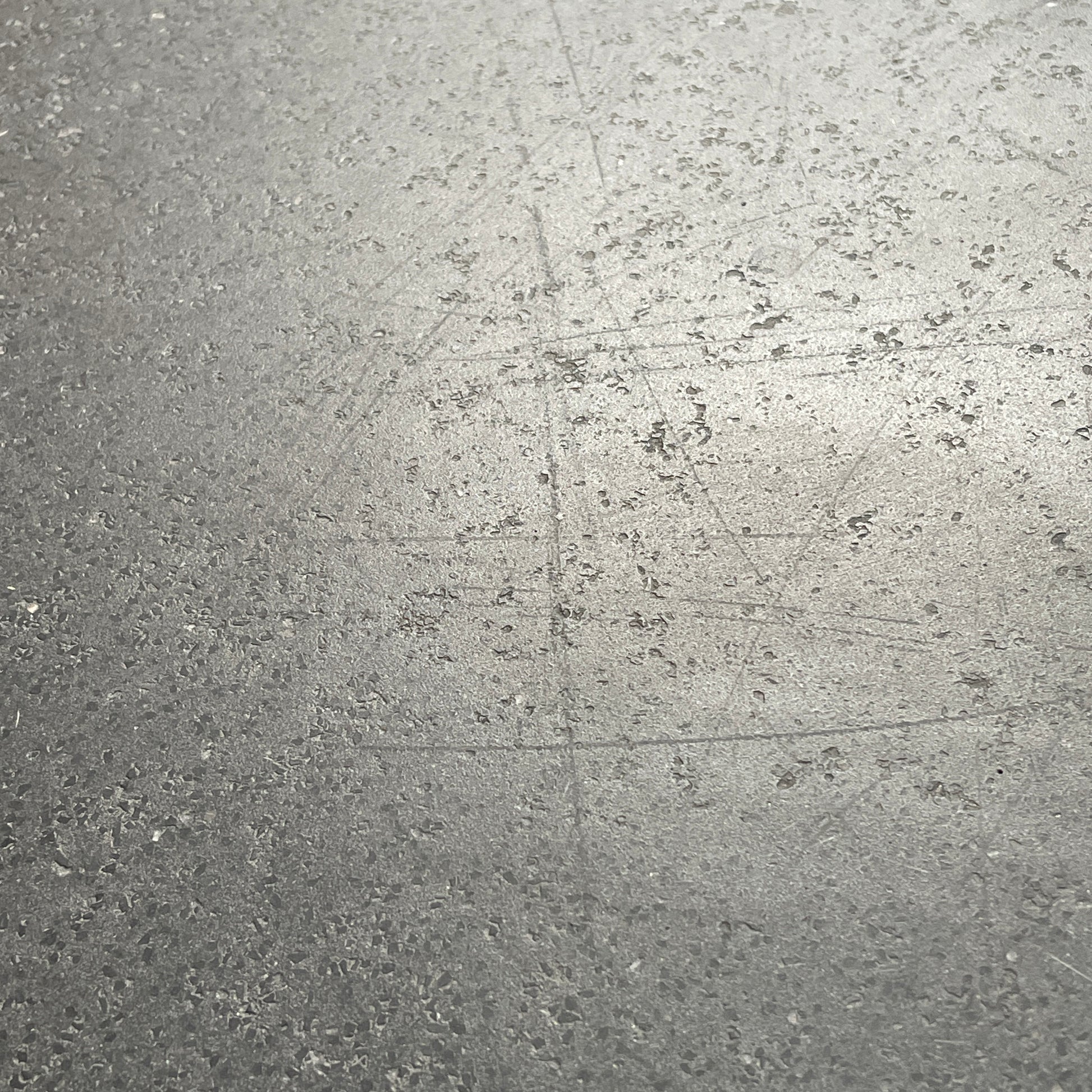 A rectangular black coffee table with asymmetrical supports on a white background, reminiscent of the B&B Italia Tobi-Ishi Outdoor Coffee Table (hold) by B&B Italia.