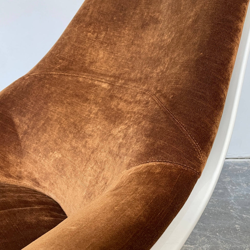 A contemporary masterpiece, the Seven Salotti Tongue Chair by Seven Salotti, is a brown and white swivel chair placed on a white background.