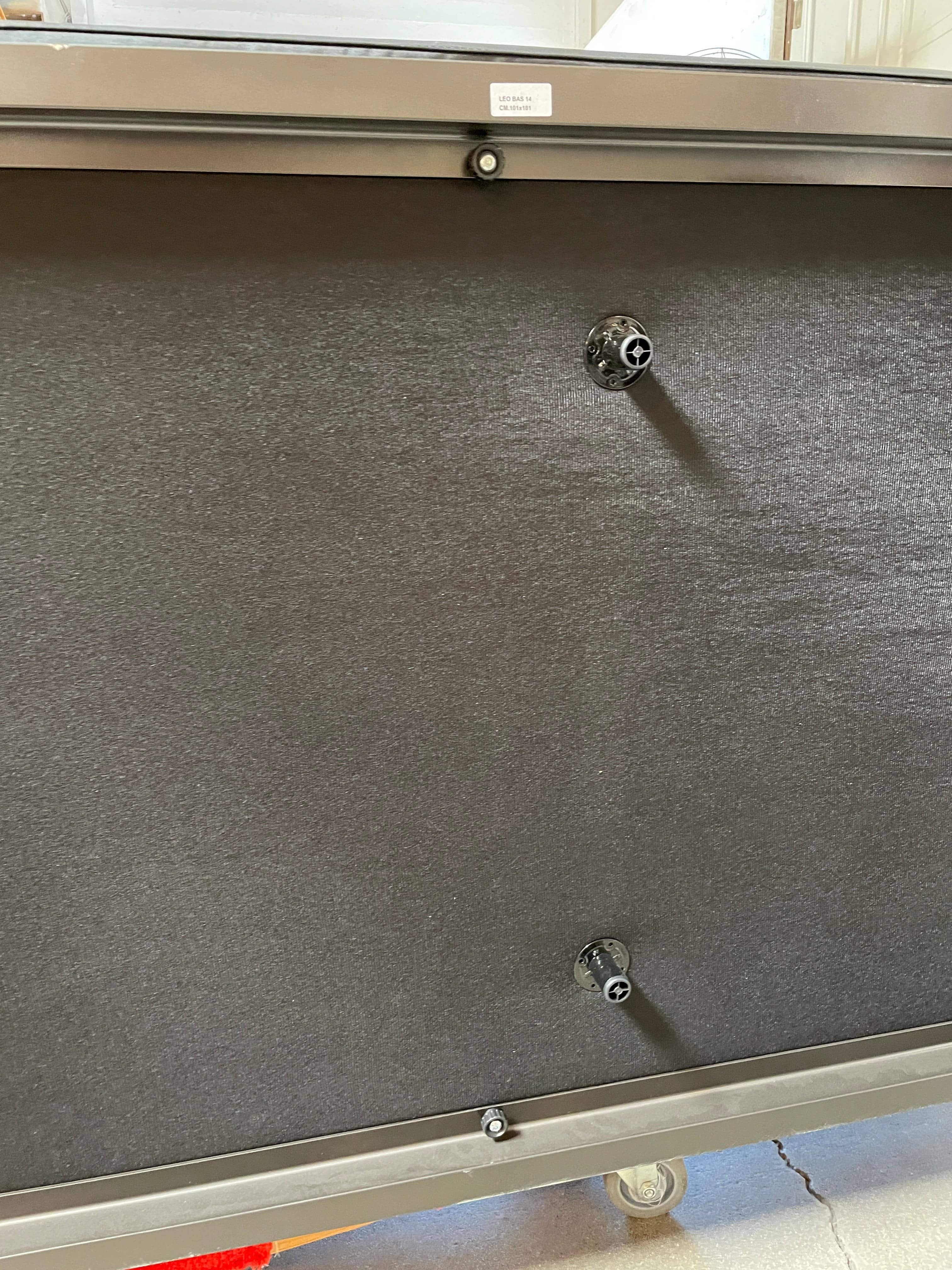 A Minotti Hamilton Black Leather Sofa with multiple cushions, designed by Rodolfo Dordoni, isolated on a white background.