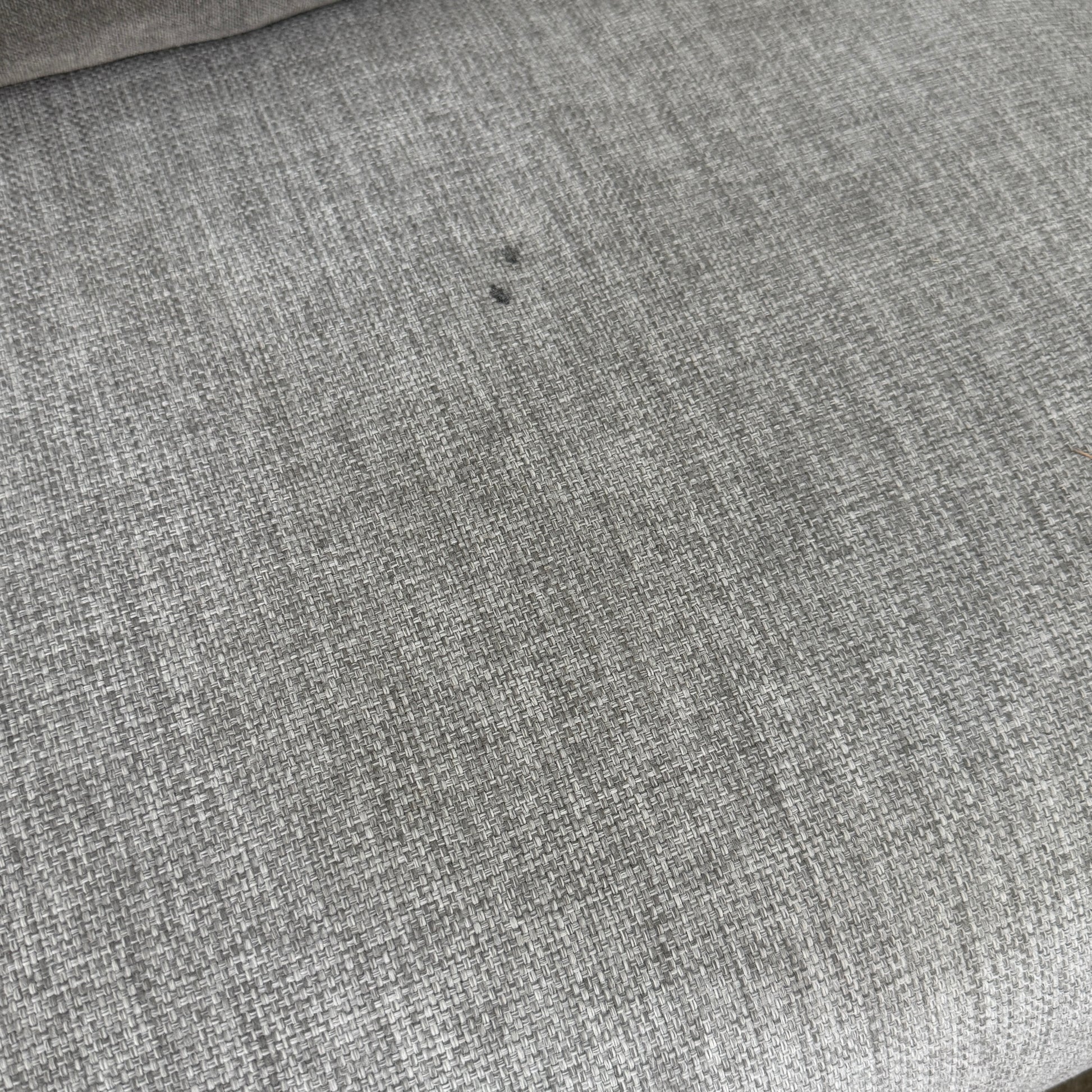 The Tribu Natal Alu Outdoor Sectional Sofa by Tribú features light gray cushions, five dark gray throw pillows, and a sleek black aluminum frame—perfect for adding modern style to your patio.