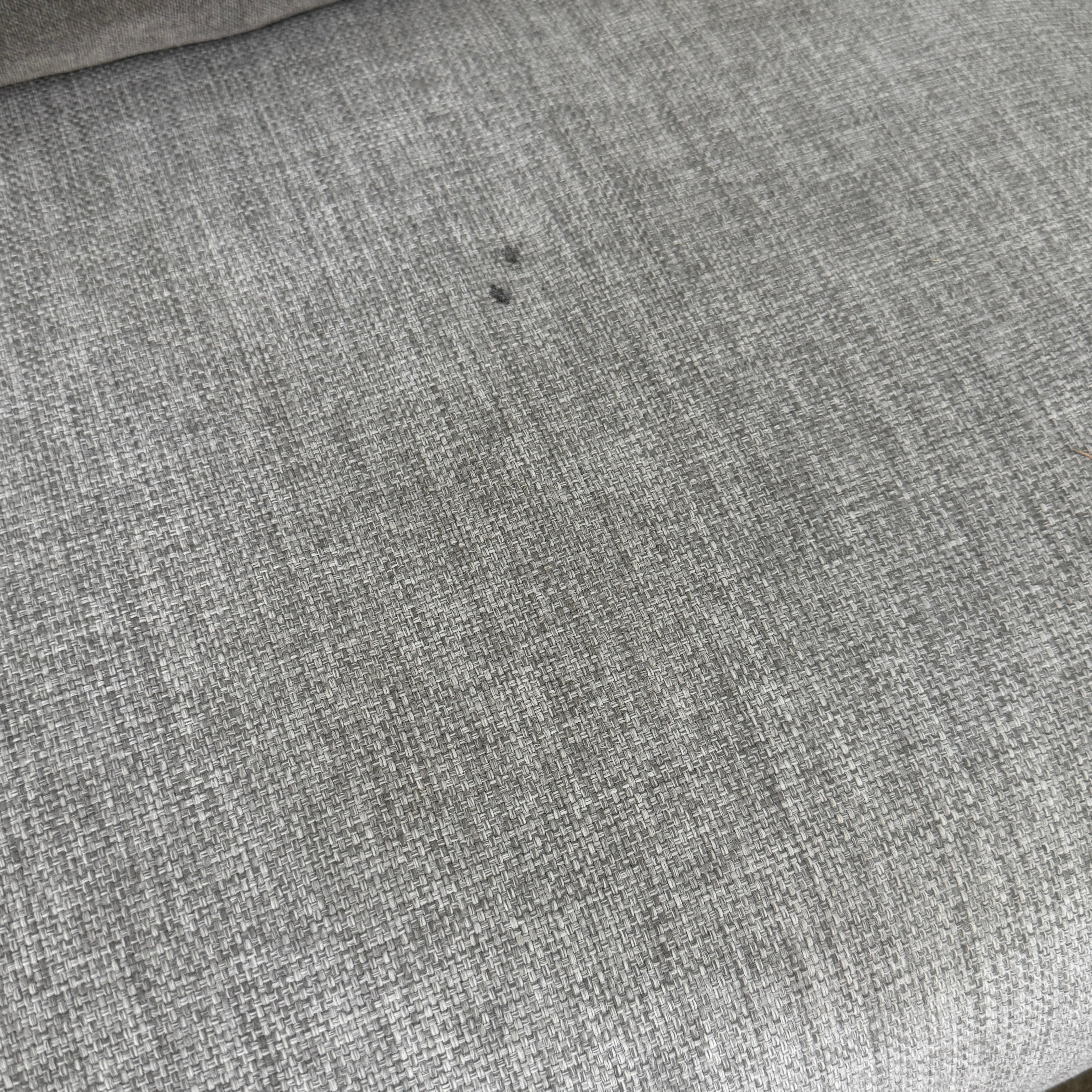 The Tribu Natal Alu Outdoor Sectional Sofa by Tribú features light gray cushions, five dark gray throw pillows, and a sleek black aluminum frame—perfect for adding modern style to your patio.