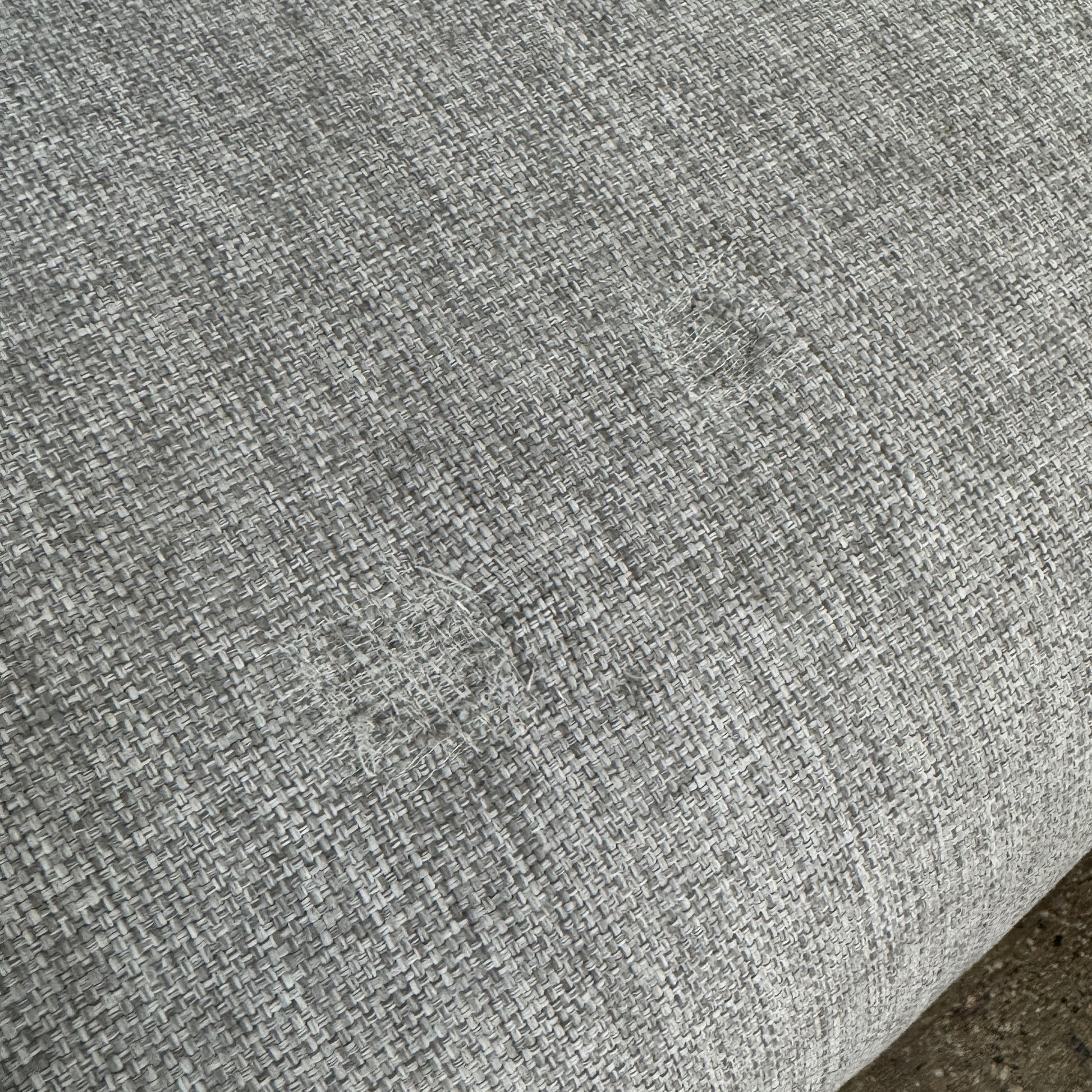 The Tribu Natal Alu Outdoor Sectional Sofa by Tribú features light gray cushions, five dark gray throw pillows, and a sleek black aluminum frame—perfect for adding modern style to your patio.