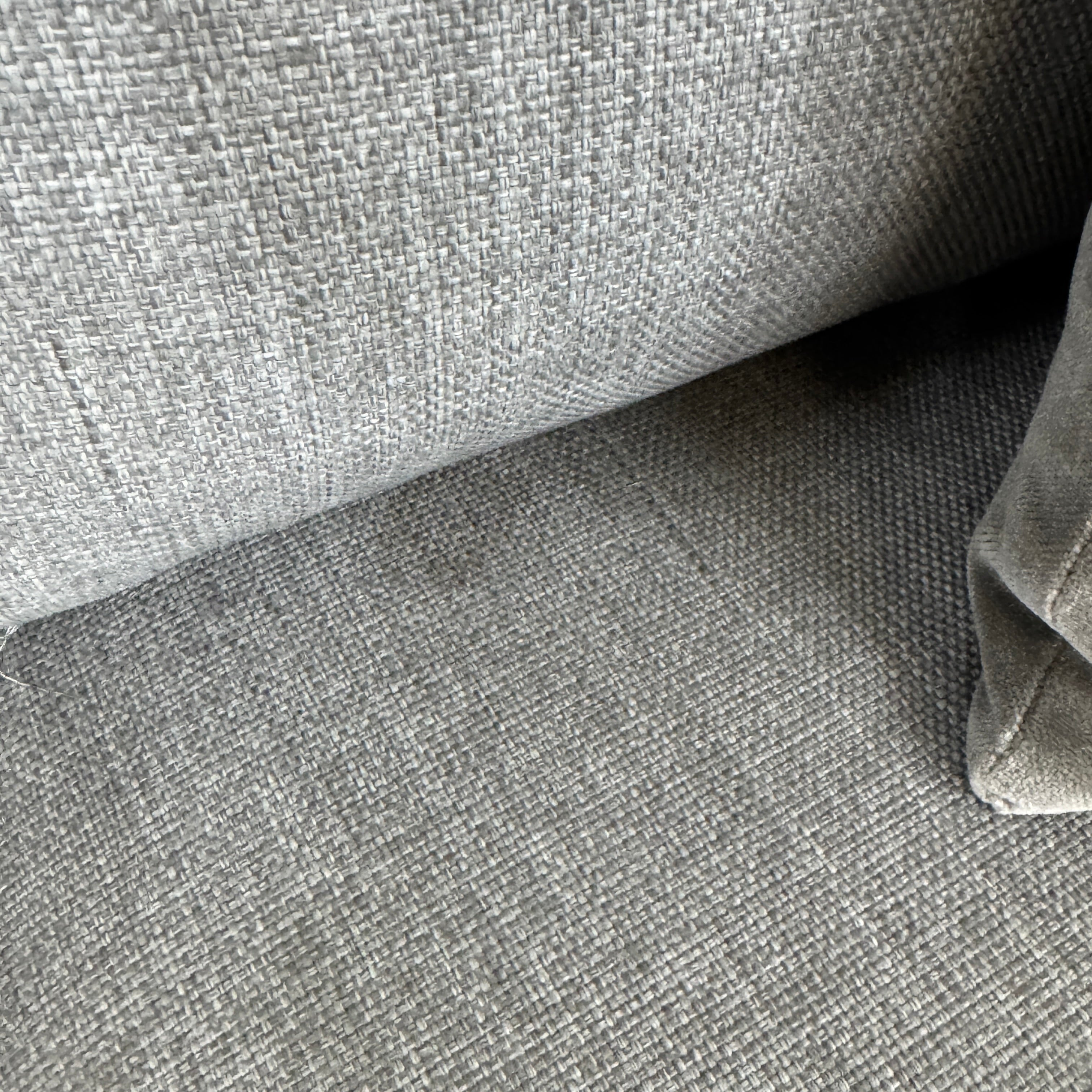 The Tribu Natal Alu Outdoor Sectional Sofa by Tribú features light gray cushions, five dark gray throw pillows, and a sleek black aluminum frame—perfect for adding modern style to your patio.