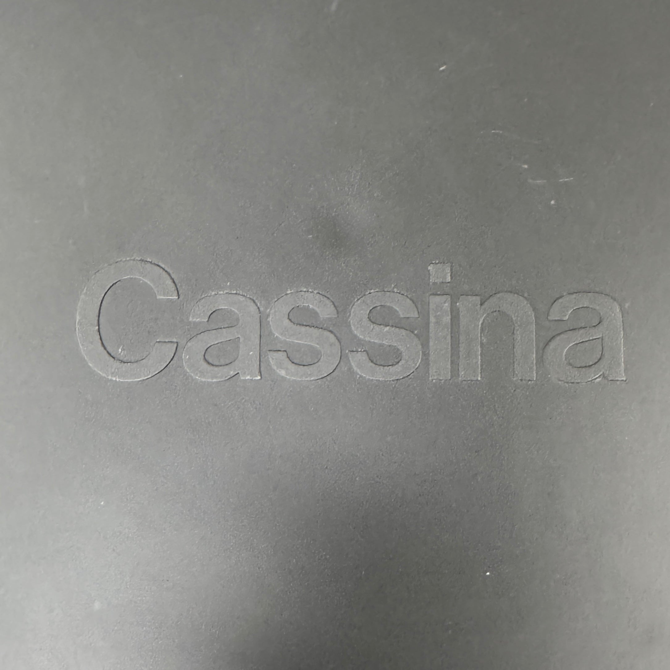 A pair of Cassina Cab 413 Dining Chairs by Cassina, featuring taupe leather and a modern design, are positioned side by side against a plain white background.