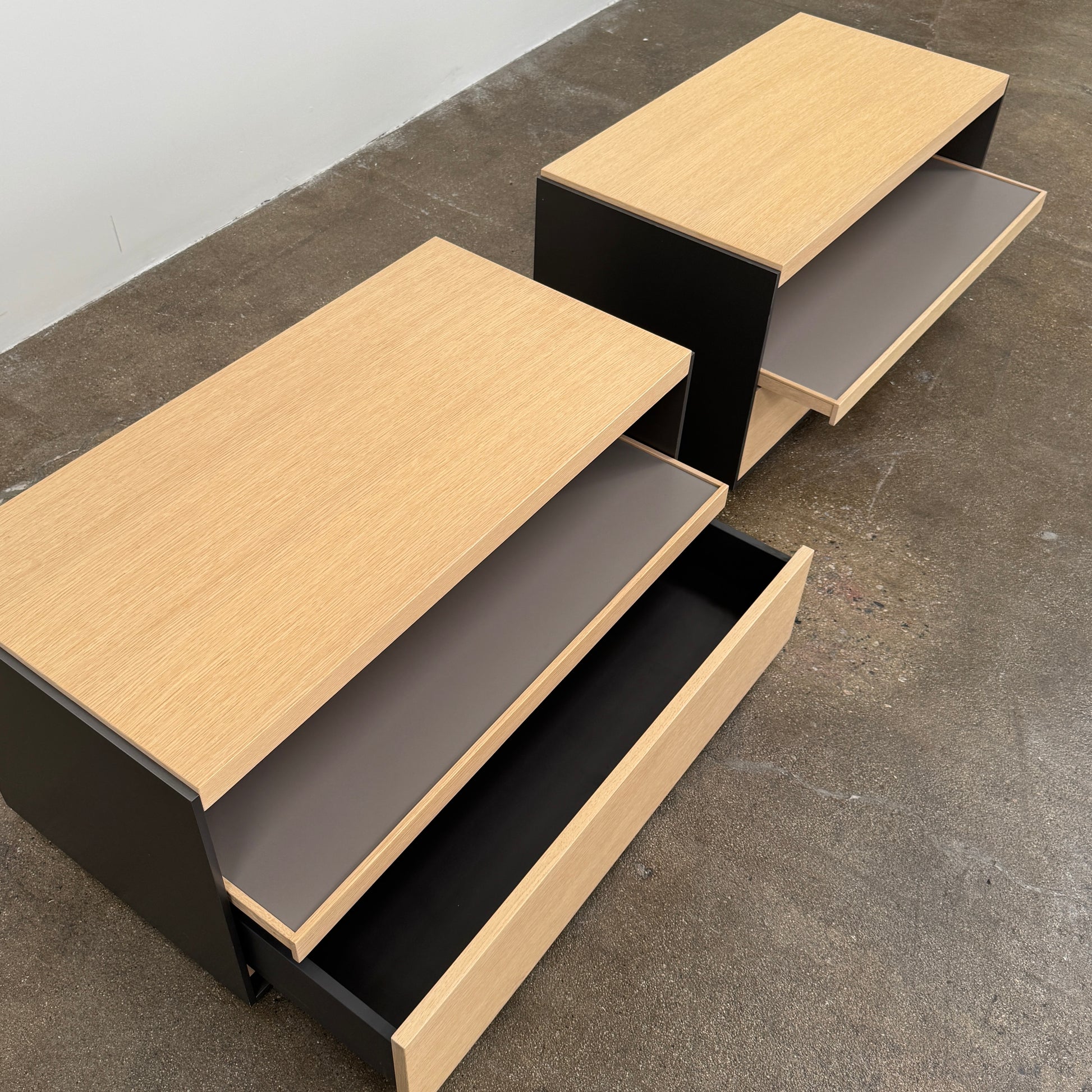 Set of 2 B&B Italia Surface Chest of Drawers with pull-out shelves, featuring light wood tops, open shelves, and lower drawers, displayed against a plain white background.