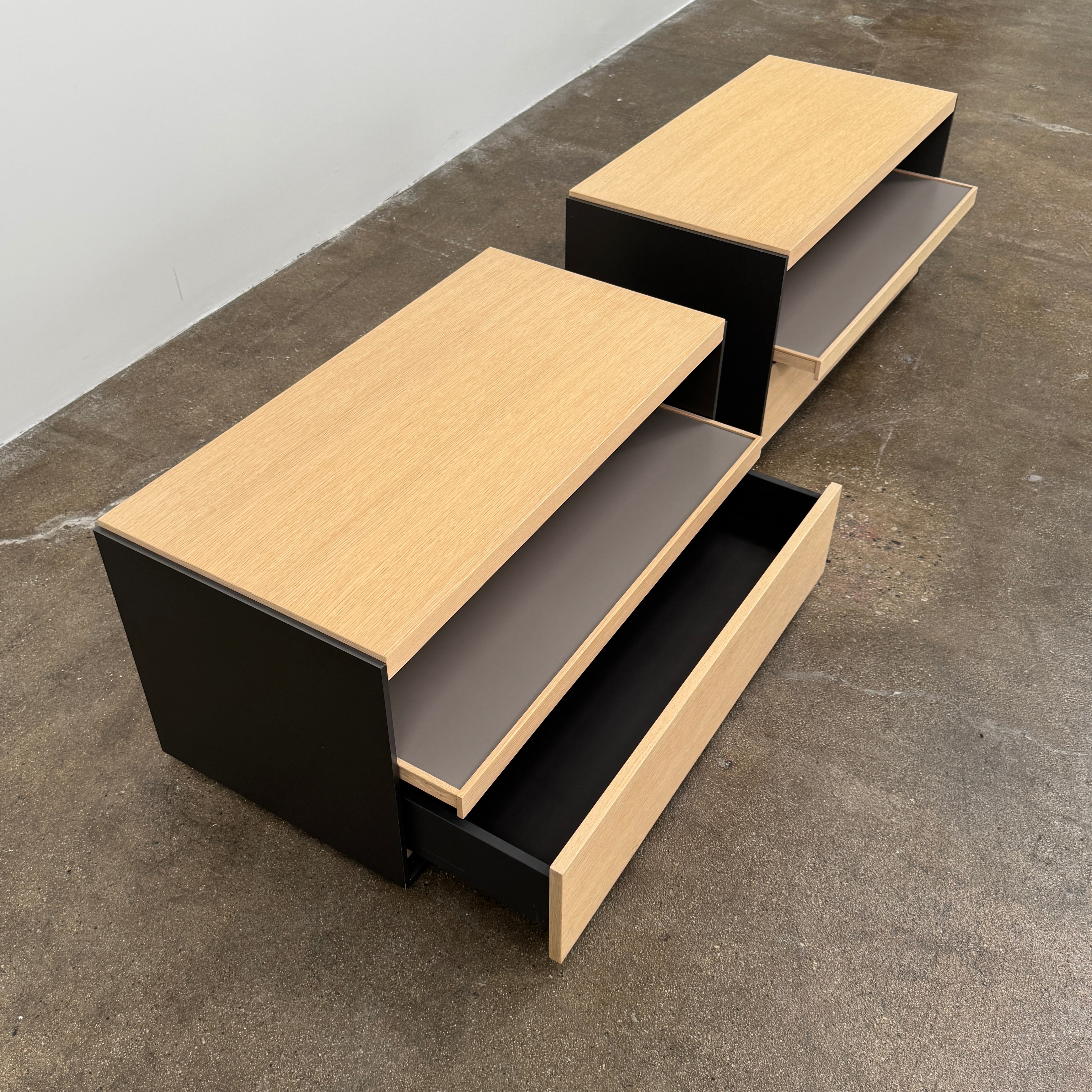 Set of 2 B&B Italia Surface Chest of Drawers with pull-out shelves, featuring light wood tops, open shelves, and lower drawers, displayed against a plain white background.