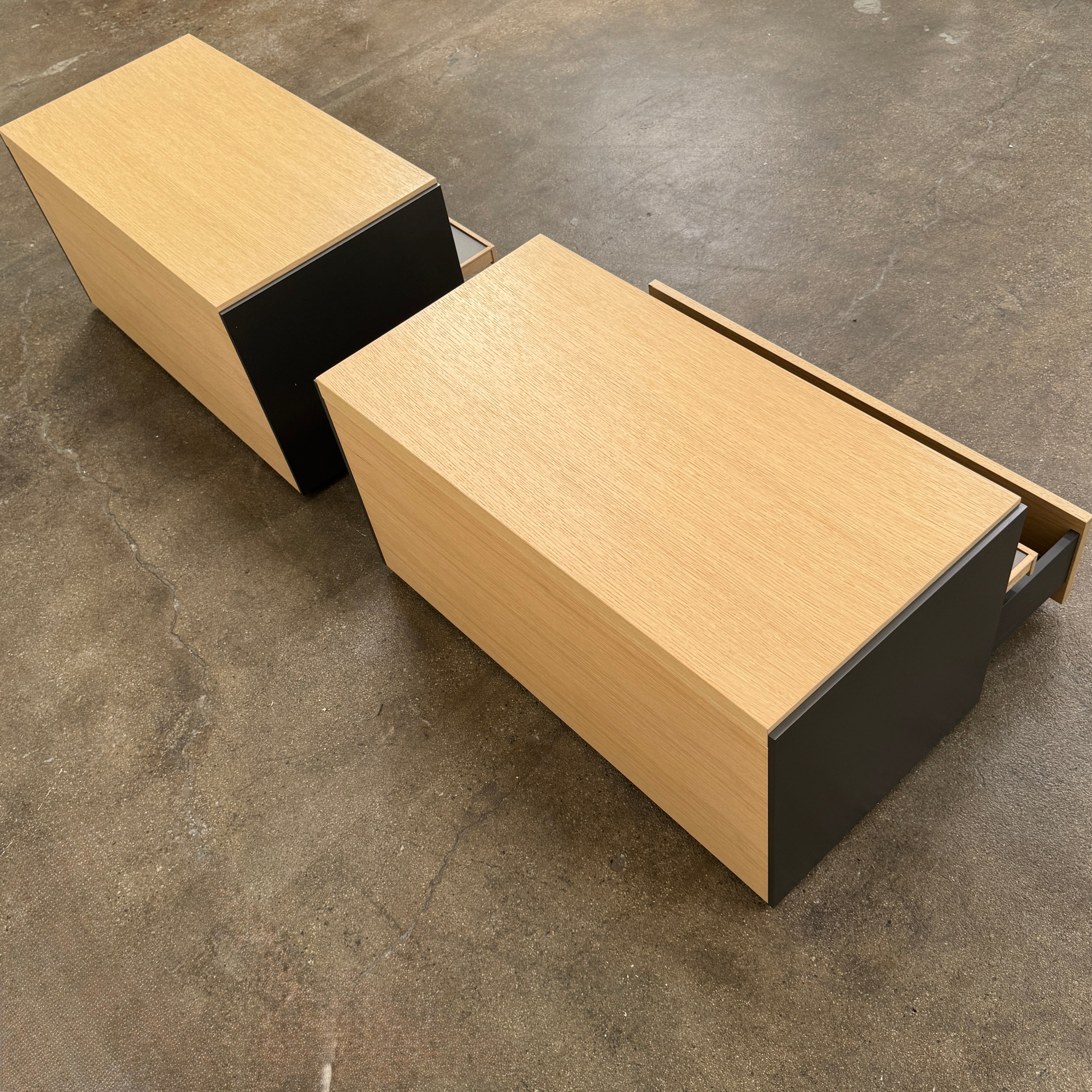 Set of 2 B&B Italia Surface Chest of Drawers with pull-out shelves, featuring light wood tops, open shelves, and lower drawers, displayed against a plain white background.