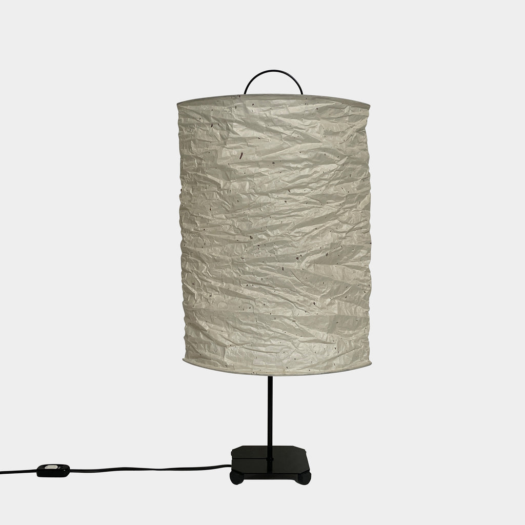 A close-up of a wrinkled white Toshiyuki Kita KYO Table Lamp made from handmade washi paper with a black metal handle, designed by Toshiyuki Kita, set against a plain white background.
