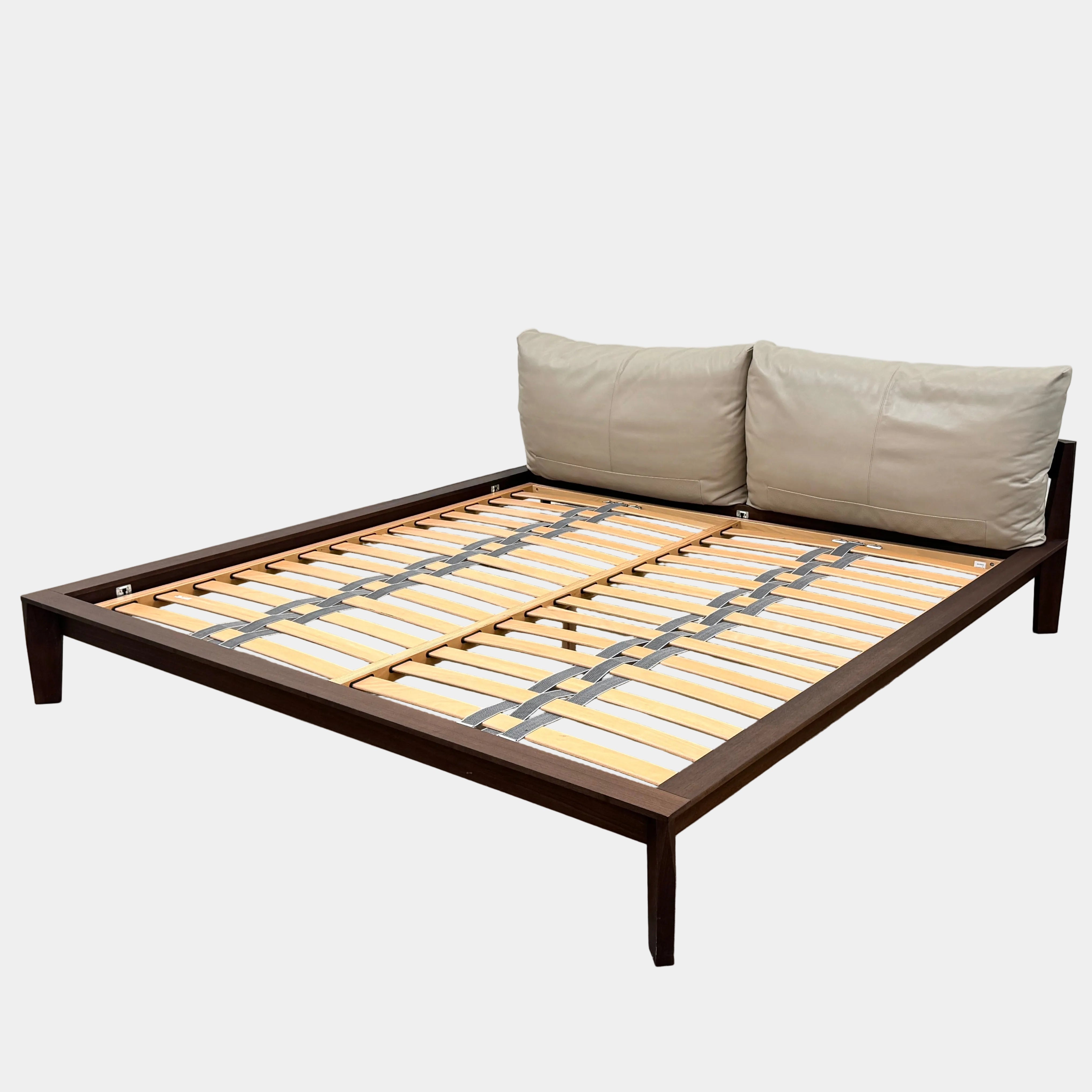 The Molteni &C Wish King Size Bed by Molteni & C features a modern solid wood frame with wooden slats, dark wood edges, and two large beige cushion headrests, shown against a plain white background.