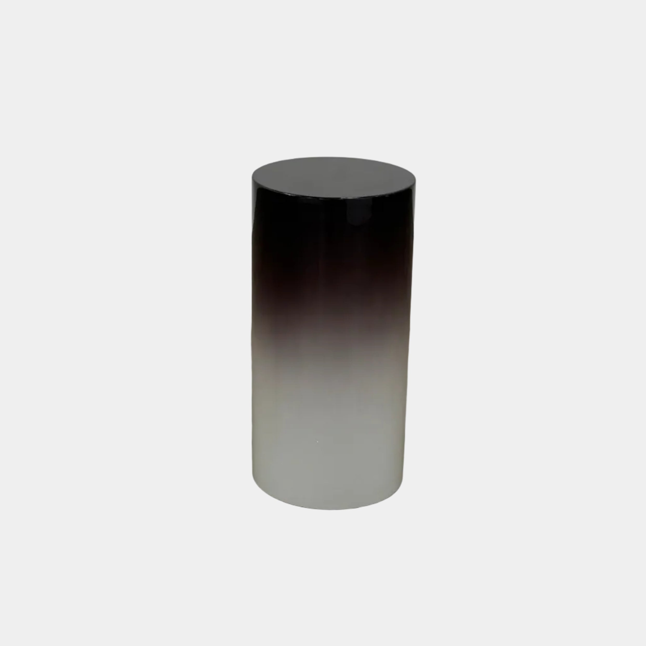 The Minotti Pilotis Accent Table by Minotti features a cylindrical form with a sleek gradient from black to white, adding a modern touch and elevating any contemporary interior furniture collection.