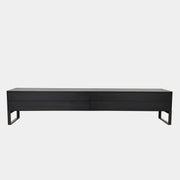 The Joan Lao Custom Media Console by Joan Lao is a black, modern low-profile piece made from sustainably sourced wood, featuring four drawers and open rectangular legs, shown against a plain white background.