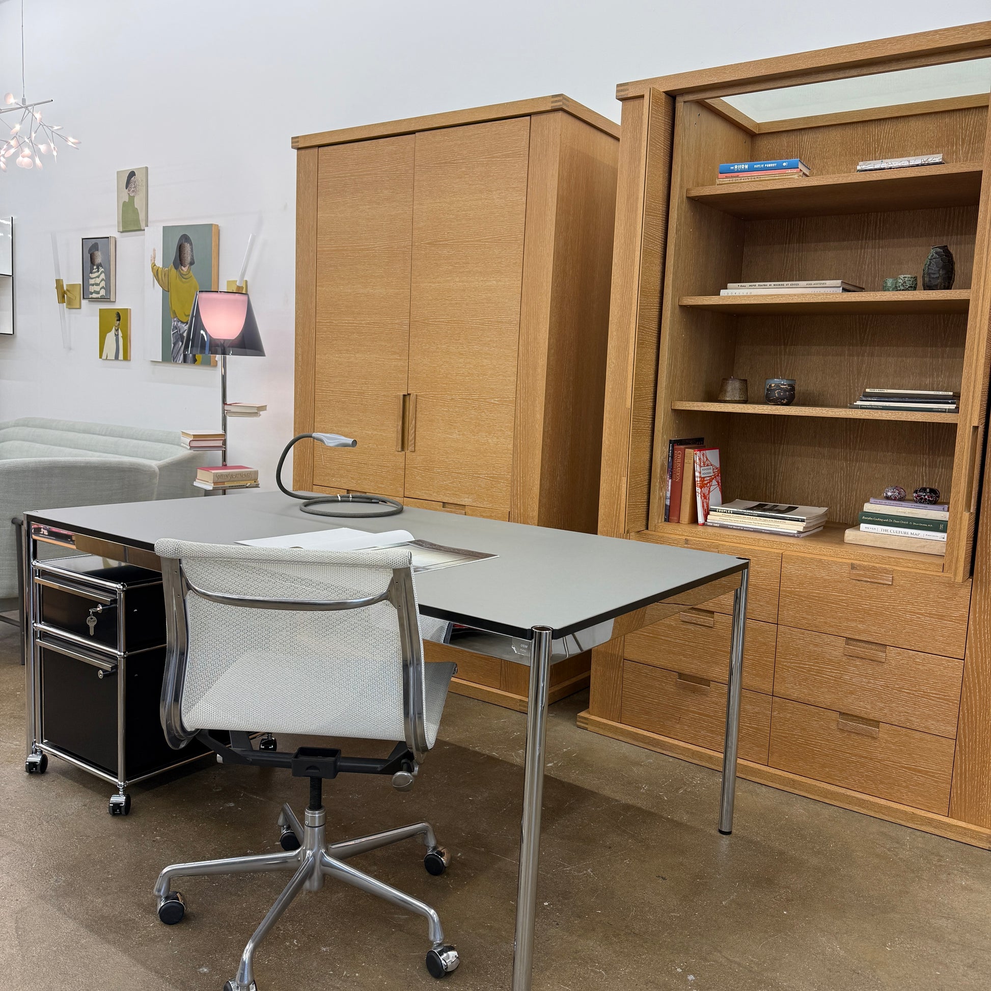 The Maxalto Apta Storage Unit by Maxalto features two vertical doors above and four bottom drawers in two rows, providing versatile storage with convenient shelves and drawers.