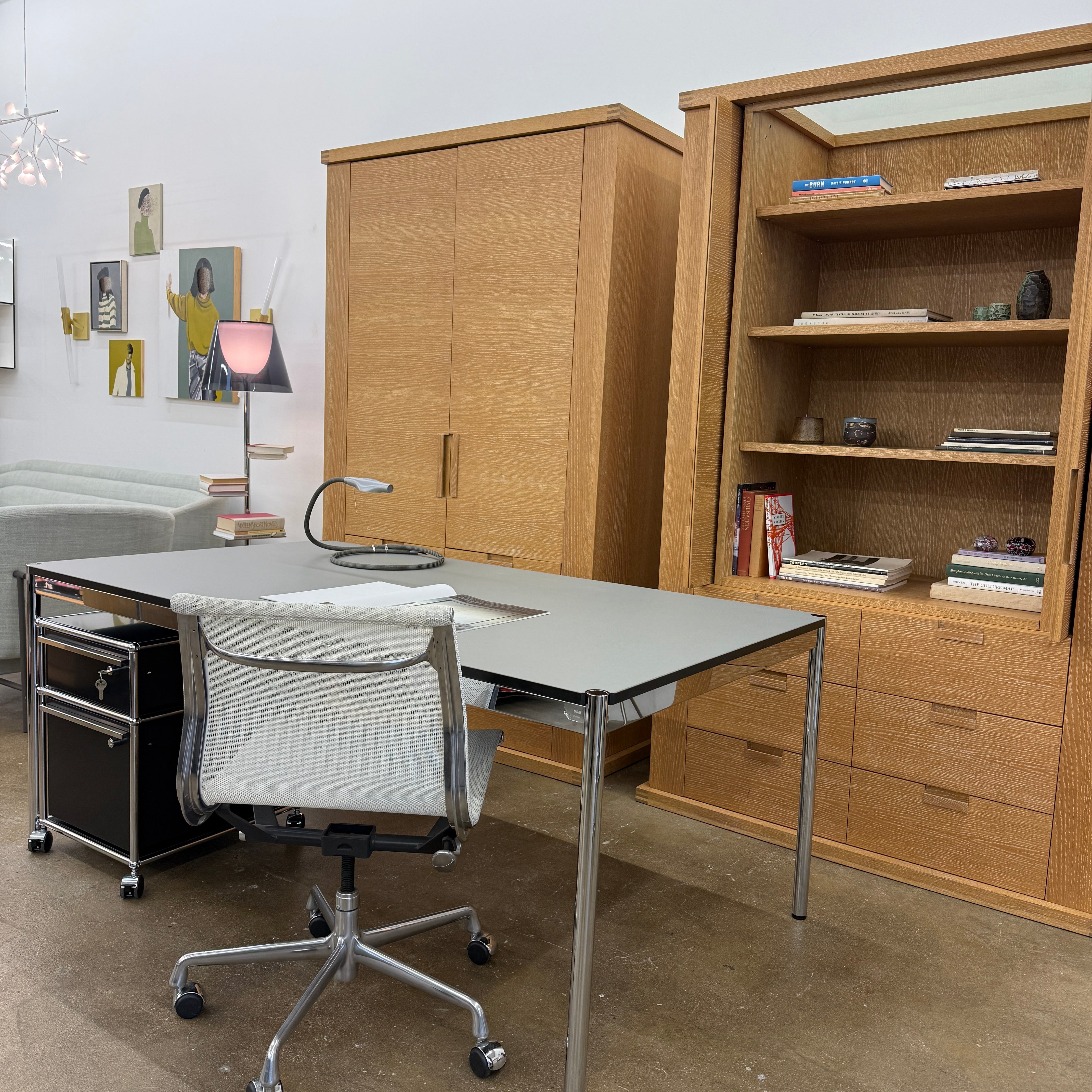 The Maxalto Apta Storage Unit by Maxalto features two vertical doors above and four bottom drawers in two rows, providing versatile storage with convenient shelves and drawers.