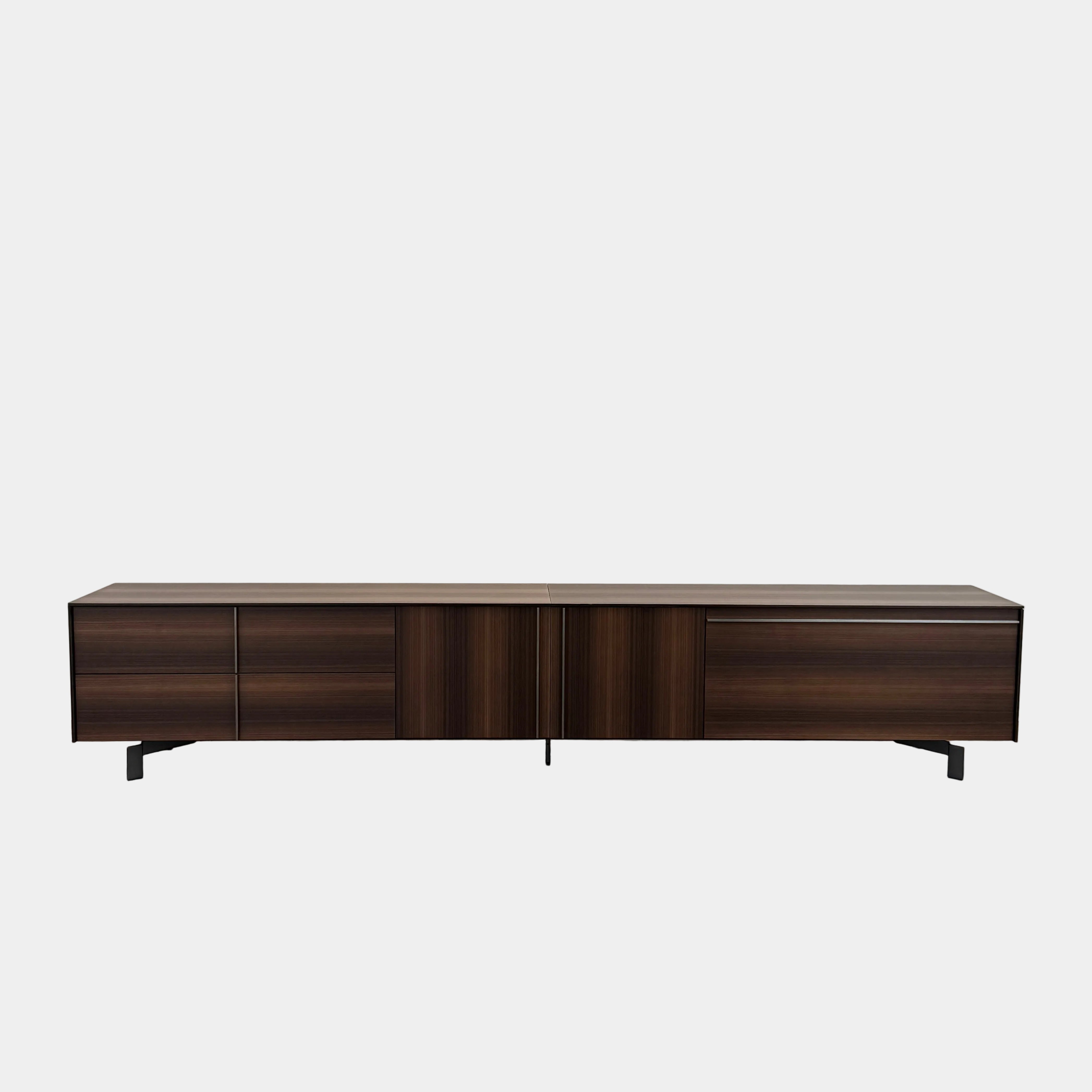 The Molteni & C Pass-word Console by Molteni & C is a modern, low-profile Eucalyptus wood sideboard with two drawers, cabinets on each side, and black metal legs, shown against a plain white background.