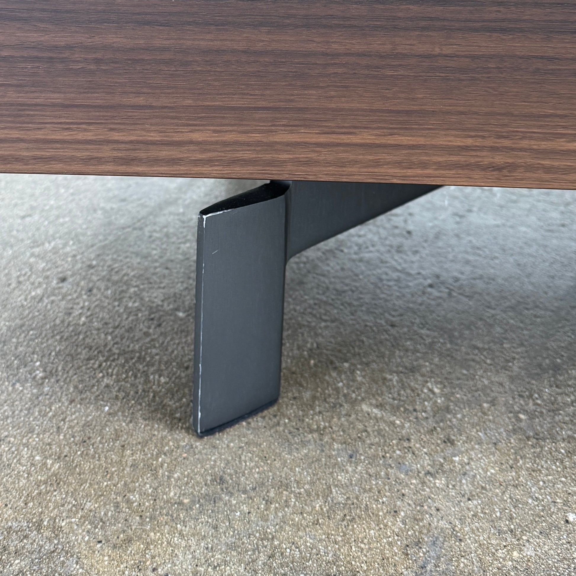 The Molteni & C Pass-word Console by Molteni & C is a modern, low-profile Eucalyptus wood sideboard with two drawers, cabinets on each side, and black metal legs, shown against a plain white background.