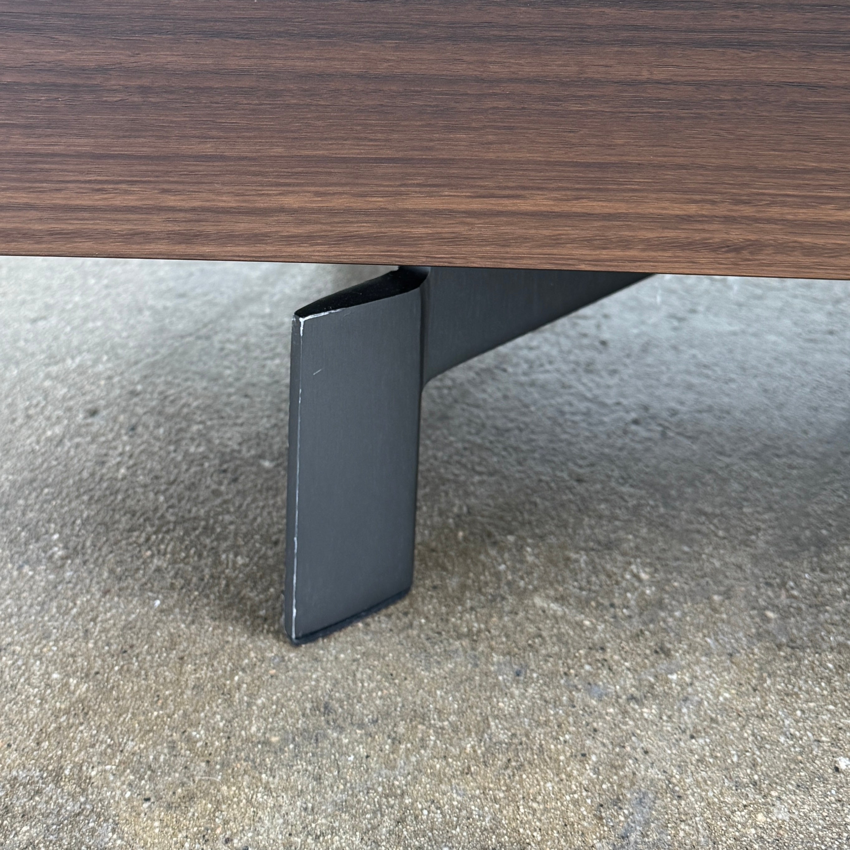 The Molteni & C Pass-word Console by Molteni & C is a modern, low-profile Eucalyptus wood sideboard with two drawers, cabinets on each side, and black metal legs, shown against a plain white background.