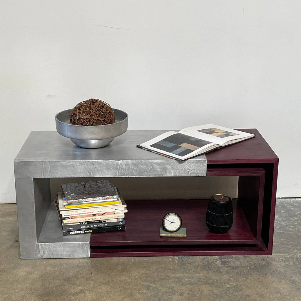 A Metal & Cherry Wood Sculptural Coffee Table with a metal frame and a burgundy color, crafted with European origins.