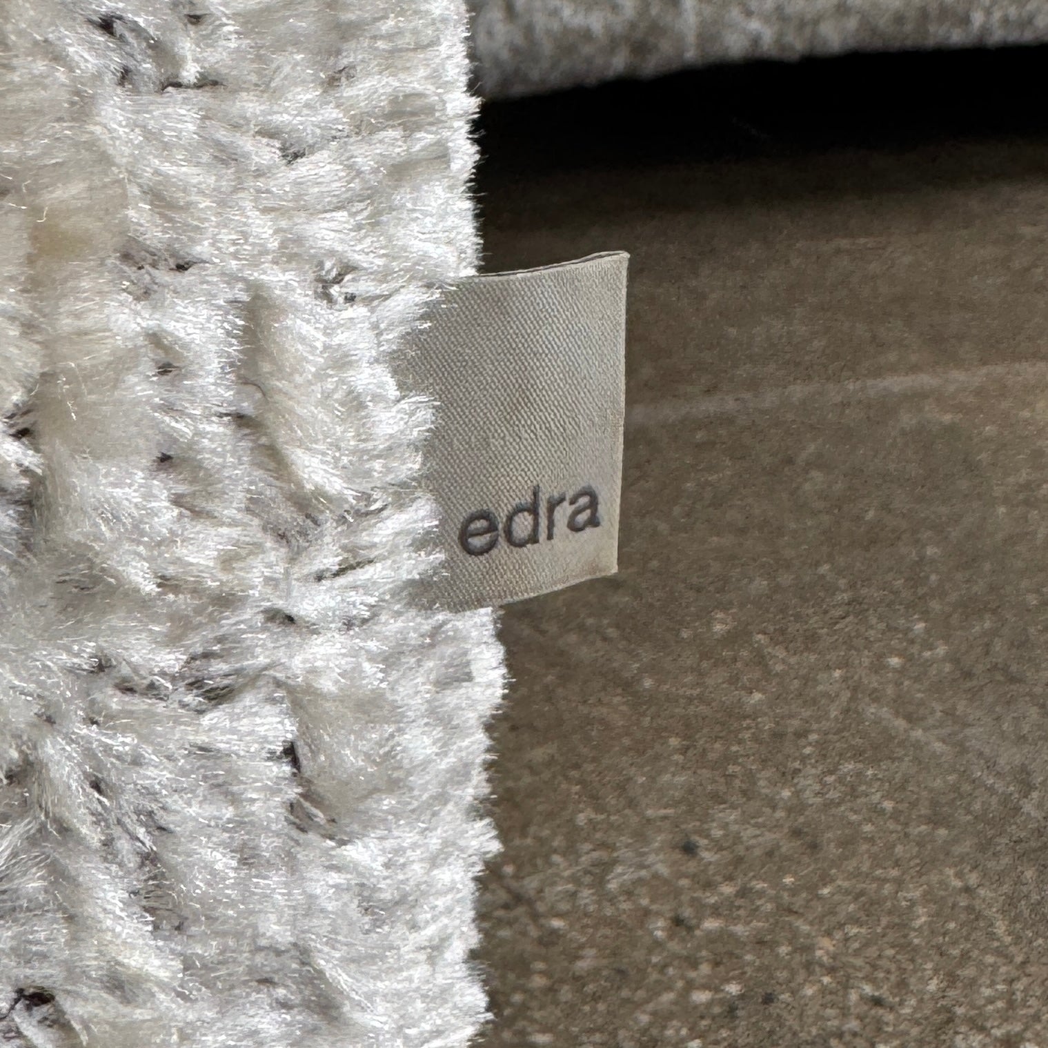 The Edra On The Rocks 4 piece Modular Sofa by Edra is a modern, light gray L-shaped sofa with customizable seating, featuring low rounded backrests and wide flat cushions, shown on a plain white background.