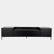 The Treku Lauki Media Unit by Treku features a black minimalist design with two closed side cabinets, two central drawers, an open shelf, and built-in cord management on slim metal legs—perfect for modern spaces.