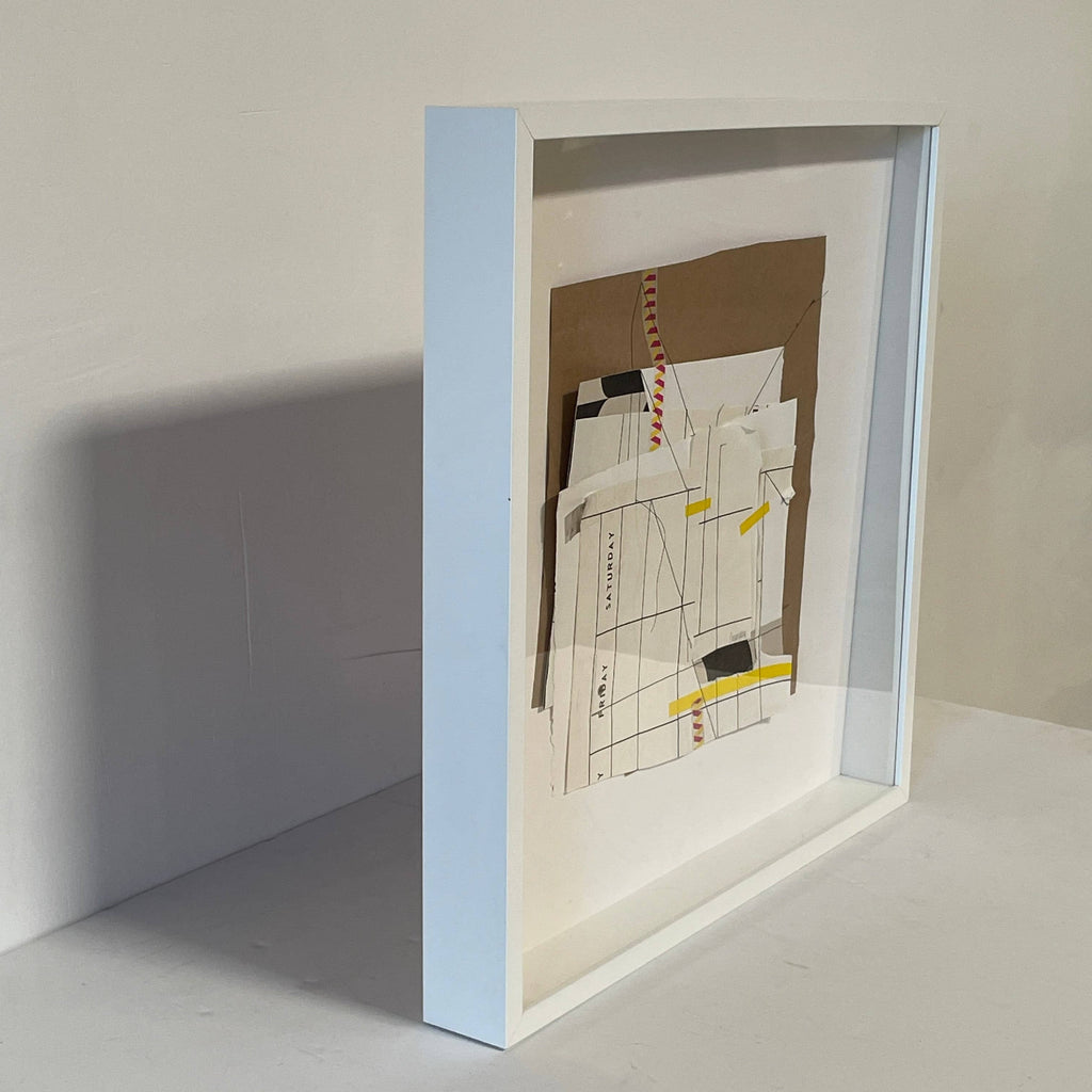A Collage: Untitled 12 piece of paper is framed in a white Allison Caesar frame.