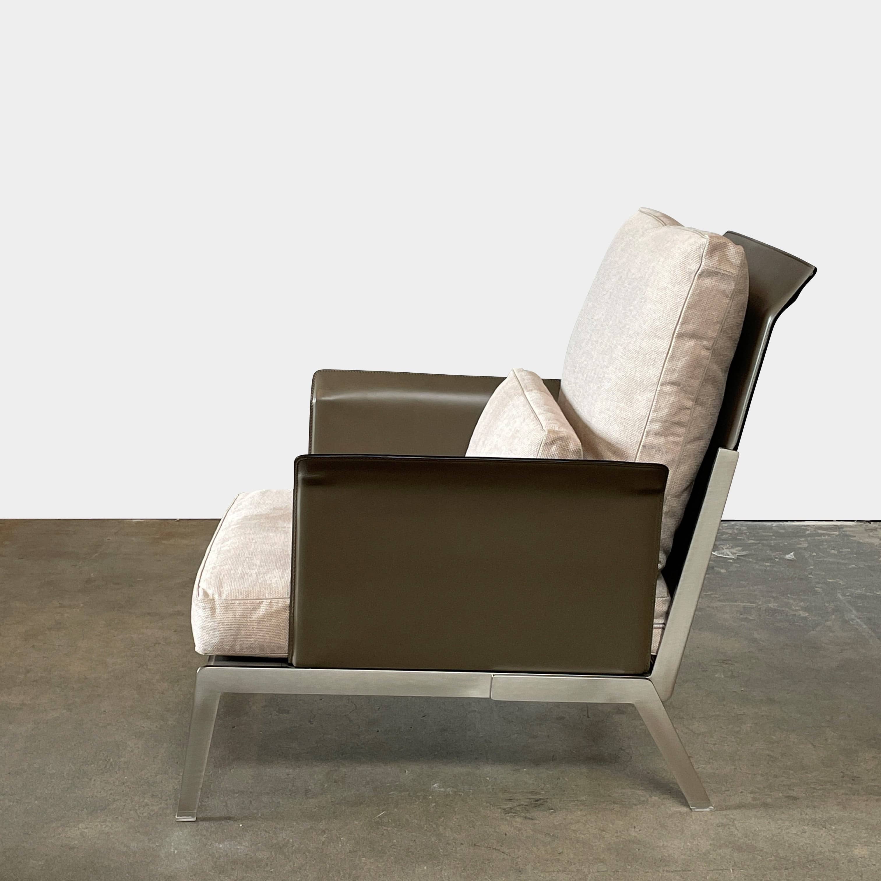 A Flexform Happy-Hour Lounge Chair with a gray cushioned seat, black metal frame, and angled legs is shown against a white background.