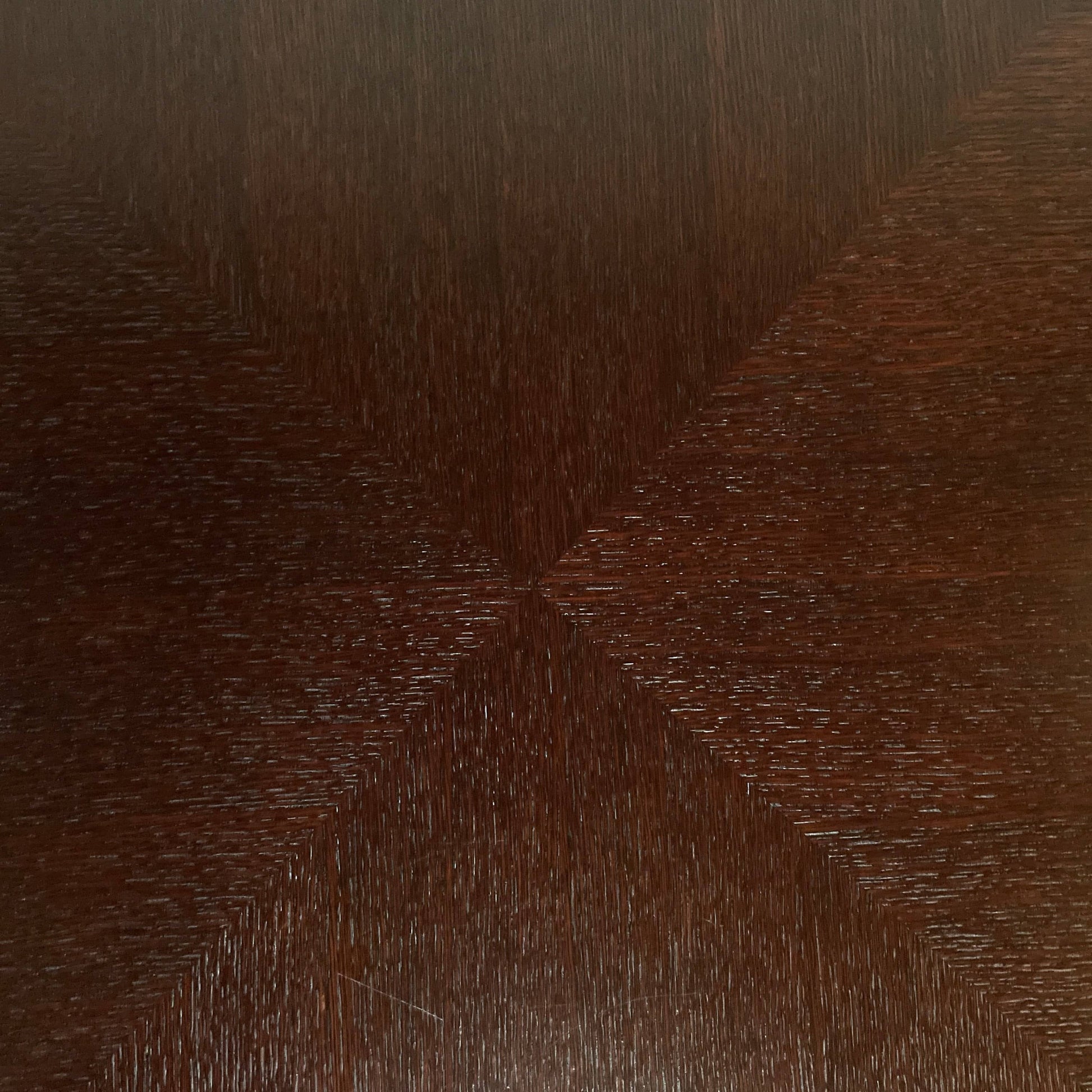 A Maxalto Xilos Dining Table with a black base.