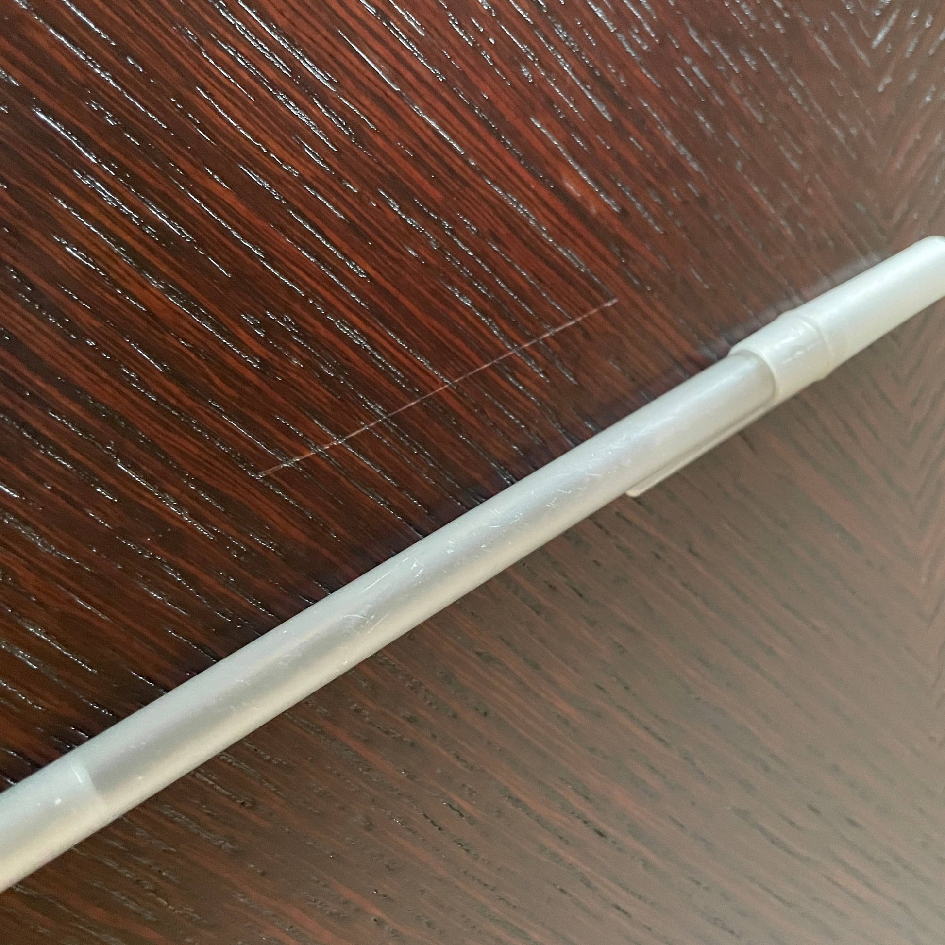 A Maxalto Xilos Dining Table with a black base.