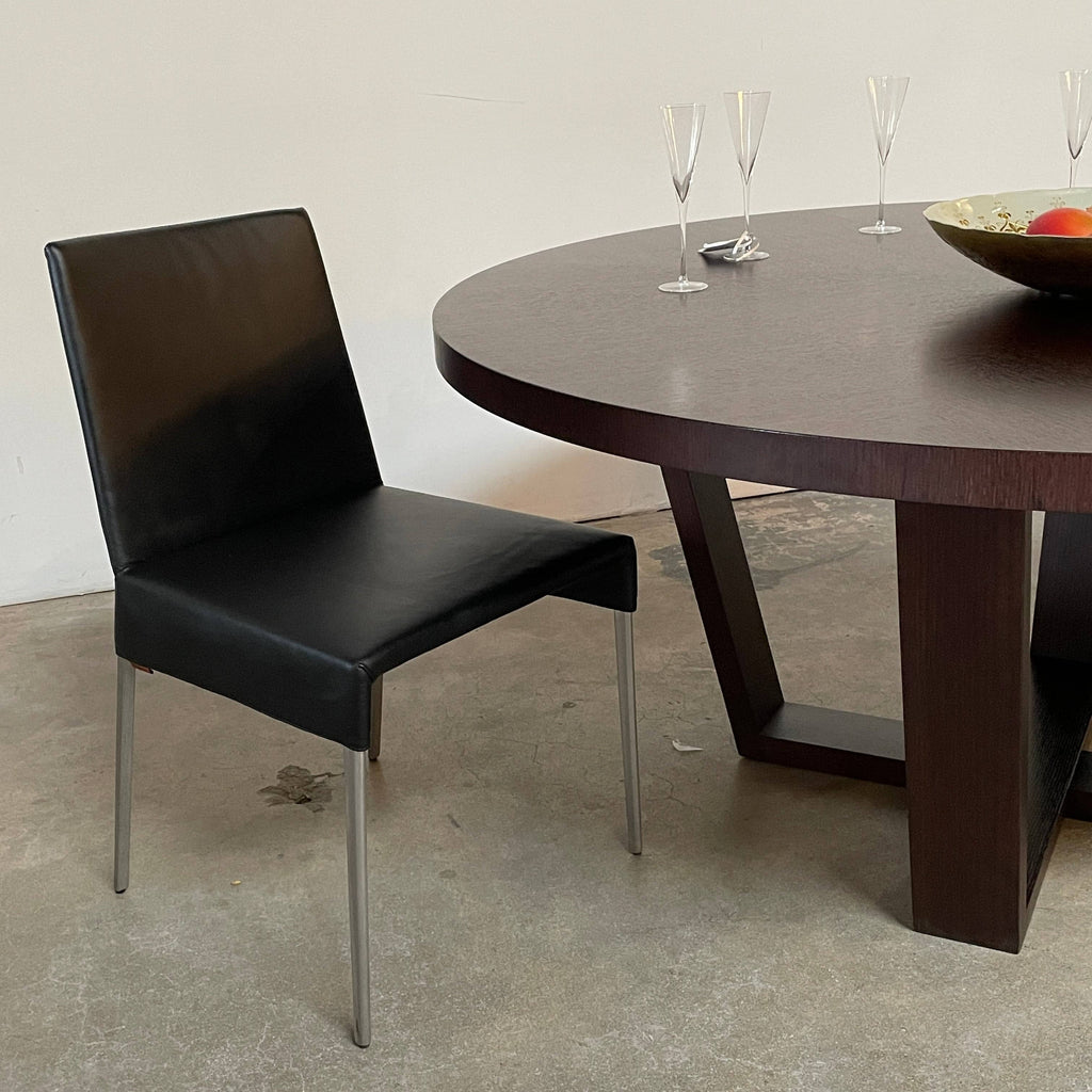 Two Montis Mila Dining Chairs against a white background.