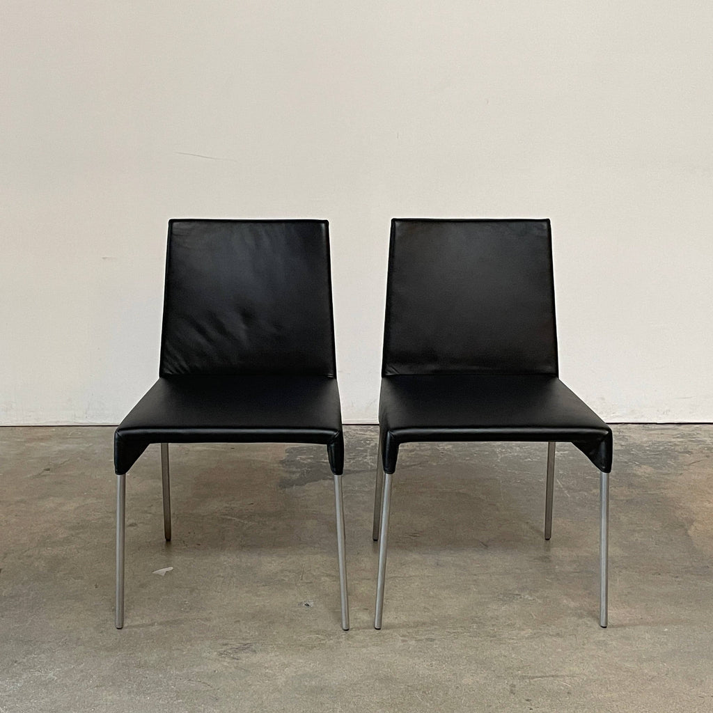 Two Montis Mila Dining Chairs against a white background.